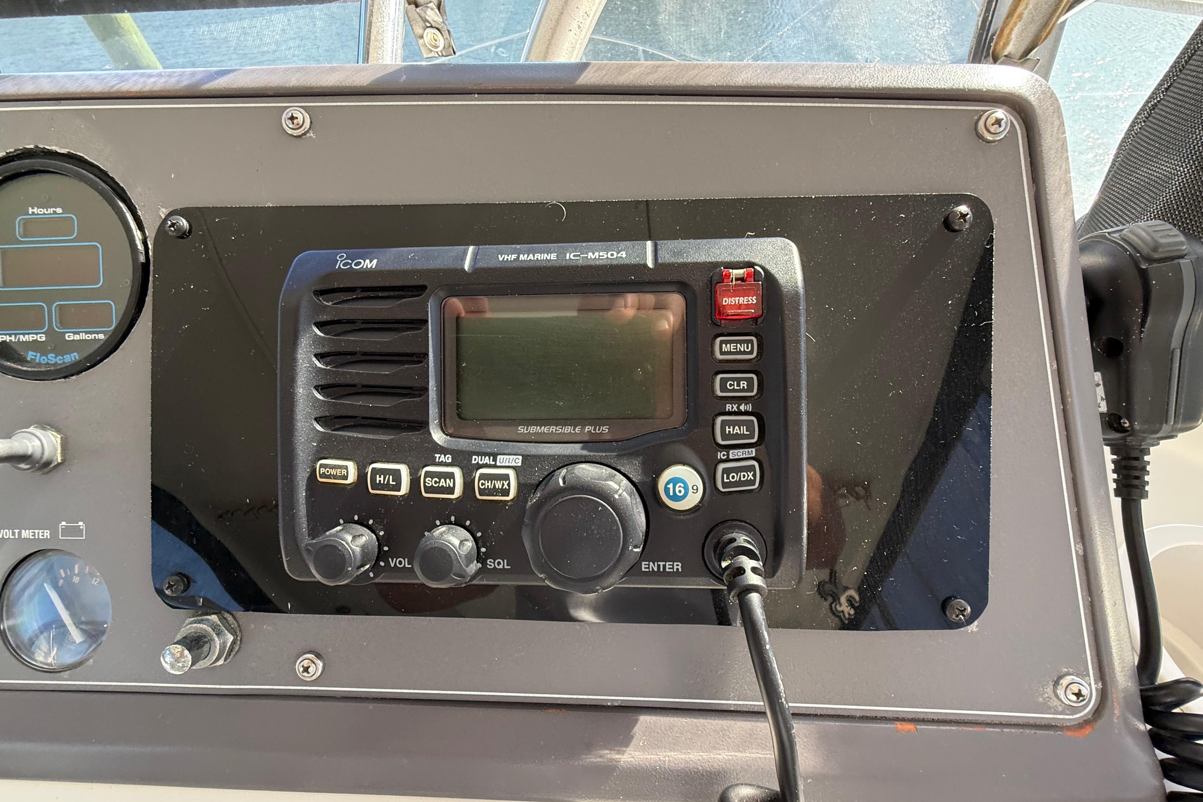 1991 Californian 55 Cockpit Motor Yacht dashboard with marine radio and gauges.