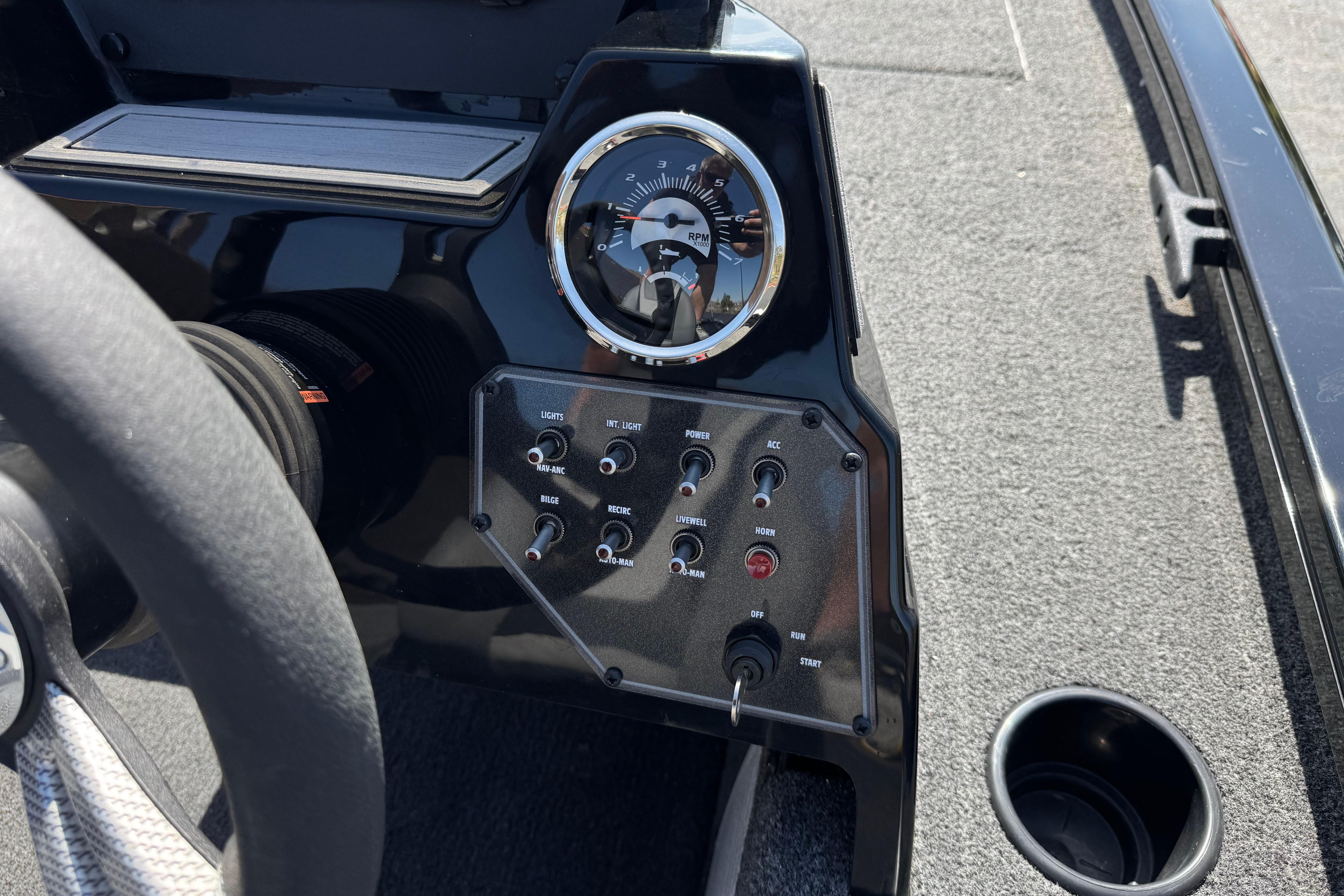 2024 Lowe Stinger 175 boat dashboard with RPM gauge and control switches.