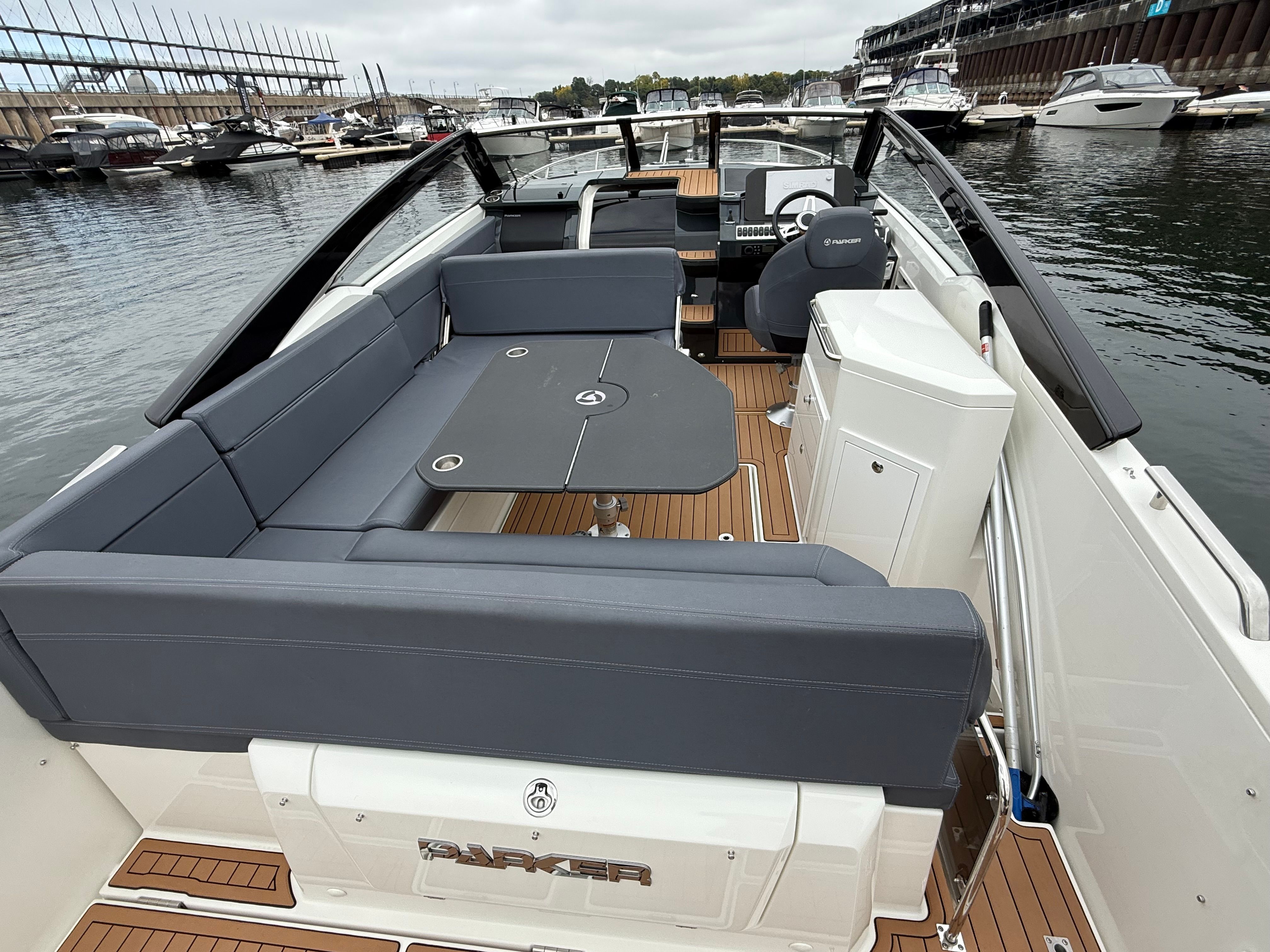 The image shows the deck of a 2022 Parker Poland 800 Cruiser with gray seating.