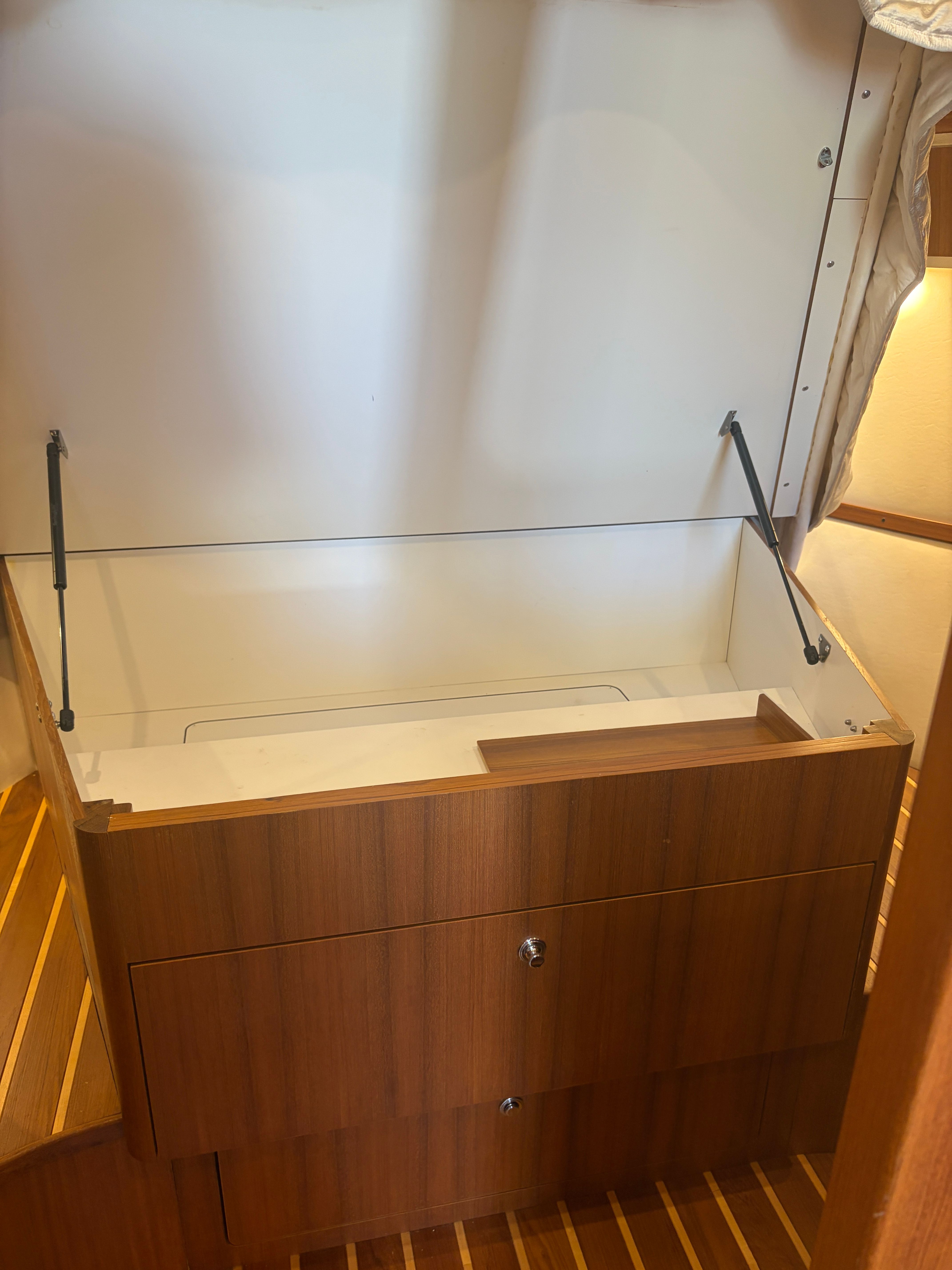 Interior of 2005 Tiara Yachts Sovran with wooden cabinet.