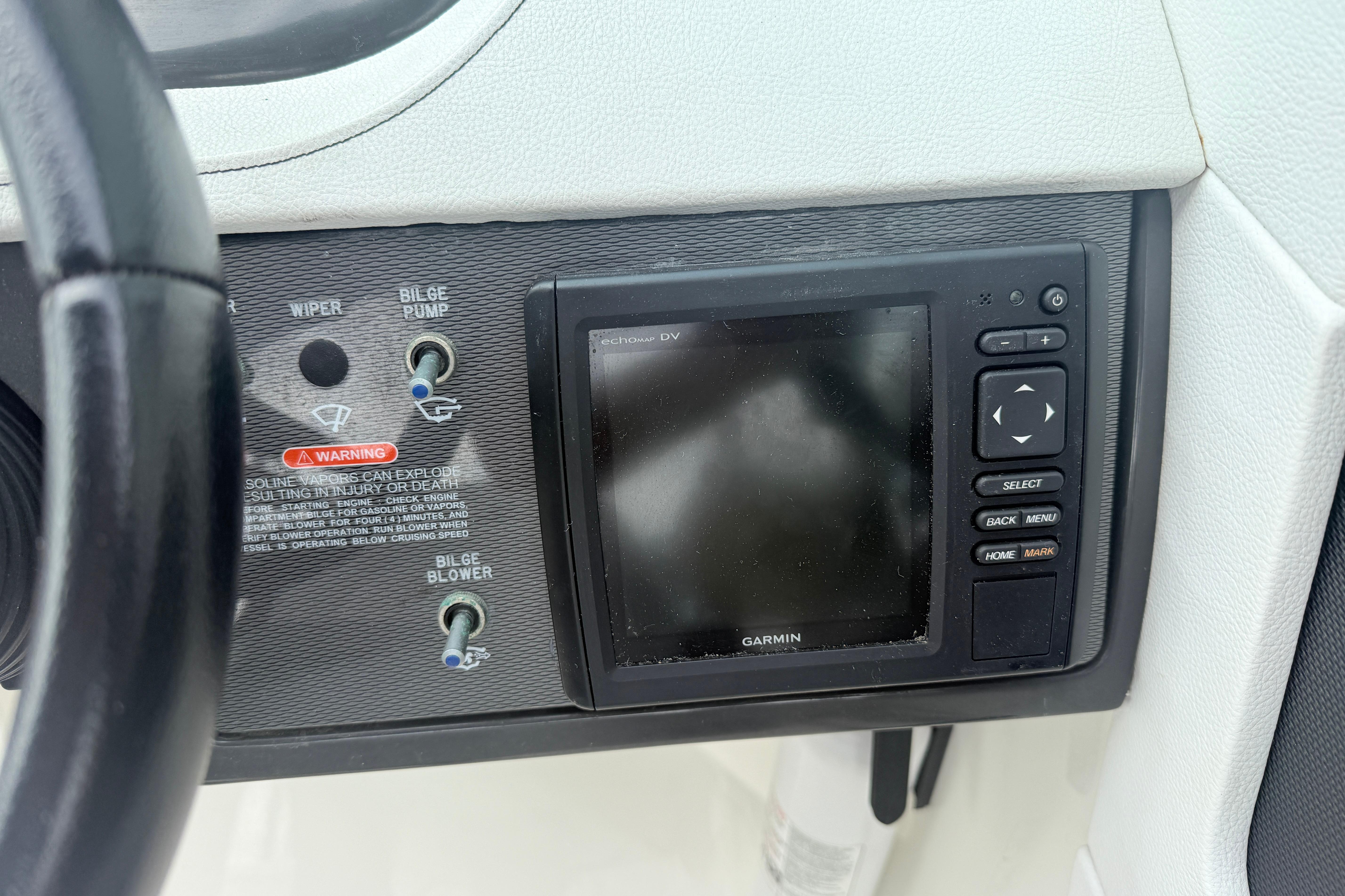 Control panel of a 2015 Sea Ray 240 Sundeck with Garmin navigation system.