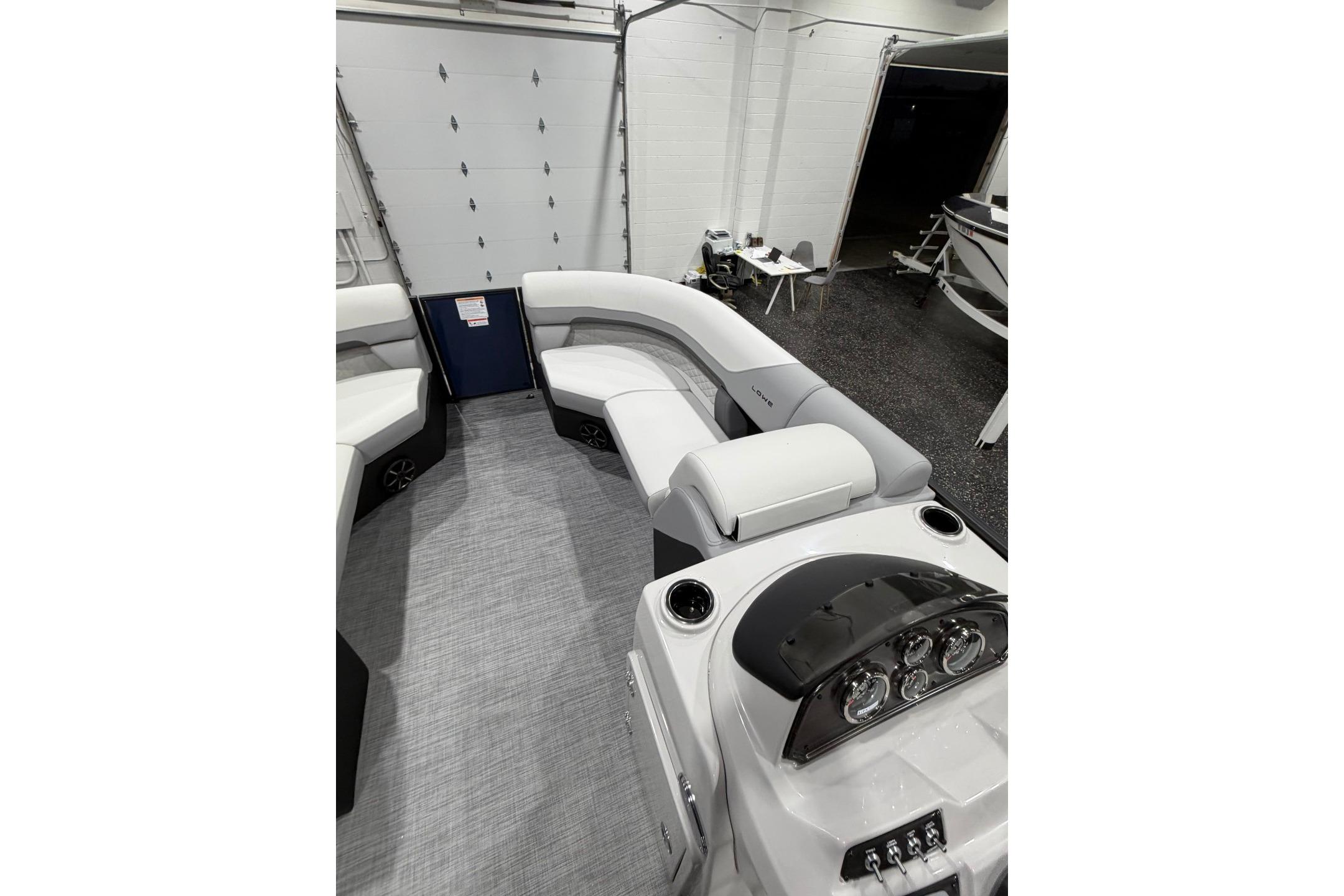 Interior of 2026 Lowe SS 230 WT boat with modern seating and dashboard.