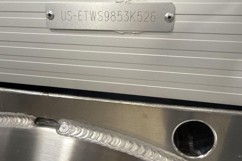 2026 Bennington 22 SSRSF boat hull identification number plate with visible weld detail.