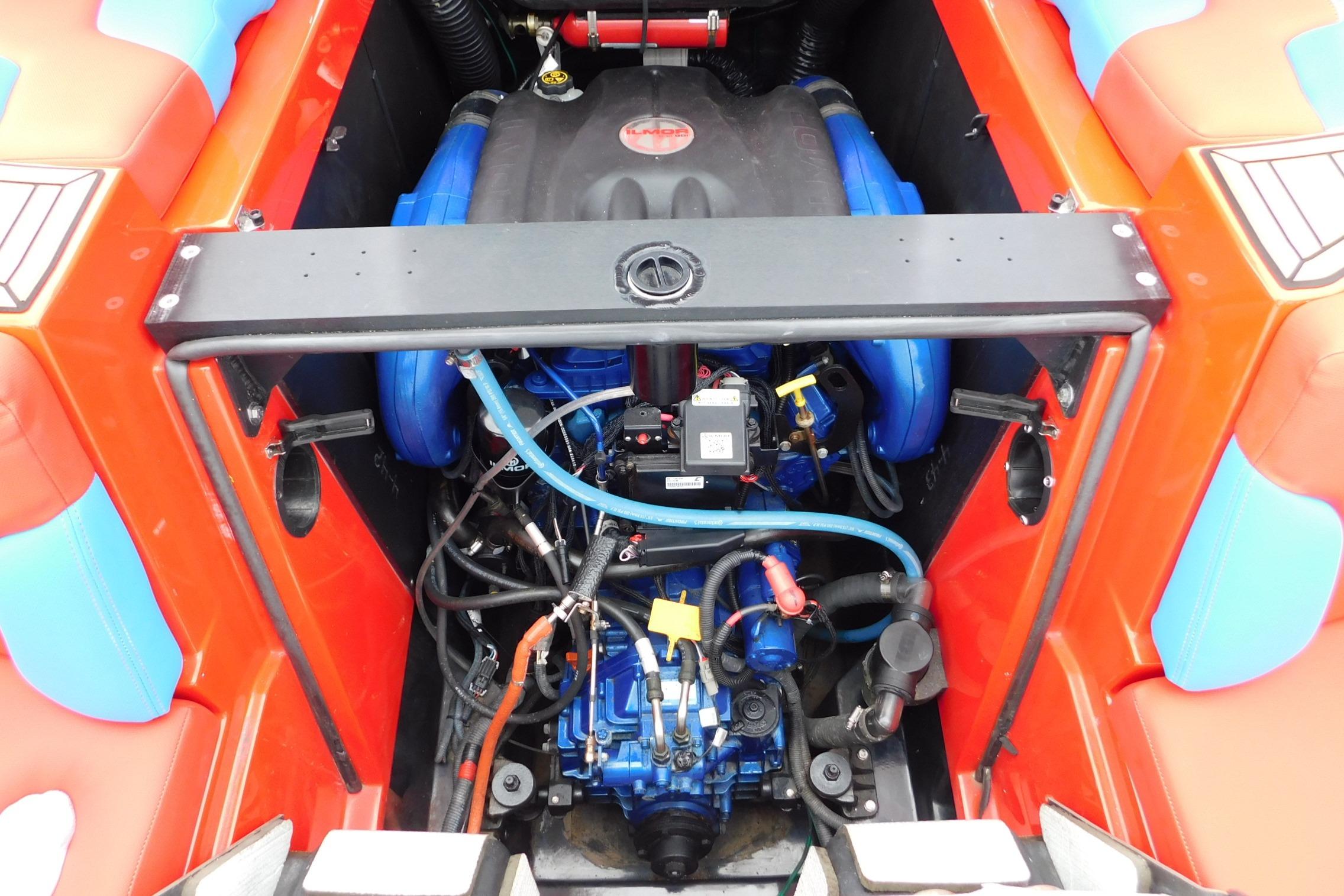 Engine compartment of a 2022 MasterCraft NXT24 boat, showcasing detailed components.