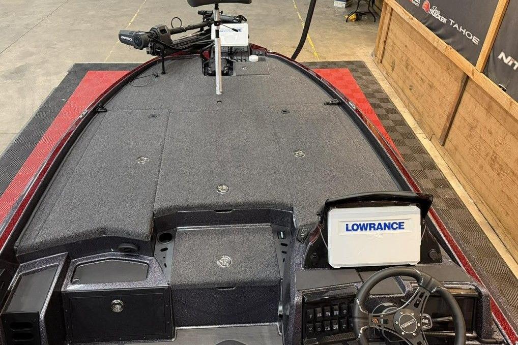 2026 Triton 20XP Patriot boat interior with Lowrance electronics and steering wheel.