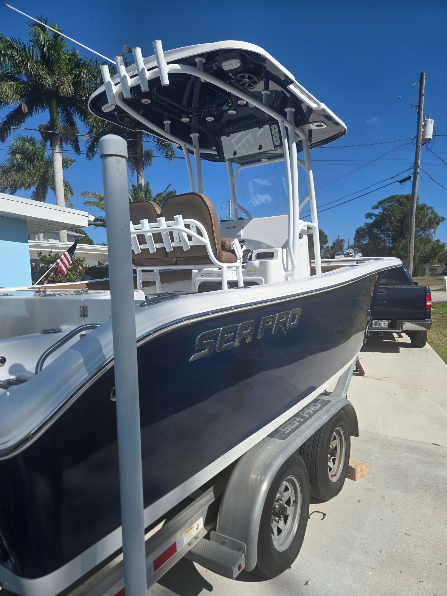 2018 Sea Pro 21.9 boat on trailer, blue hull, sunny day.