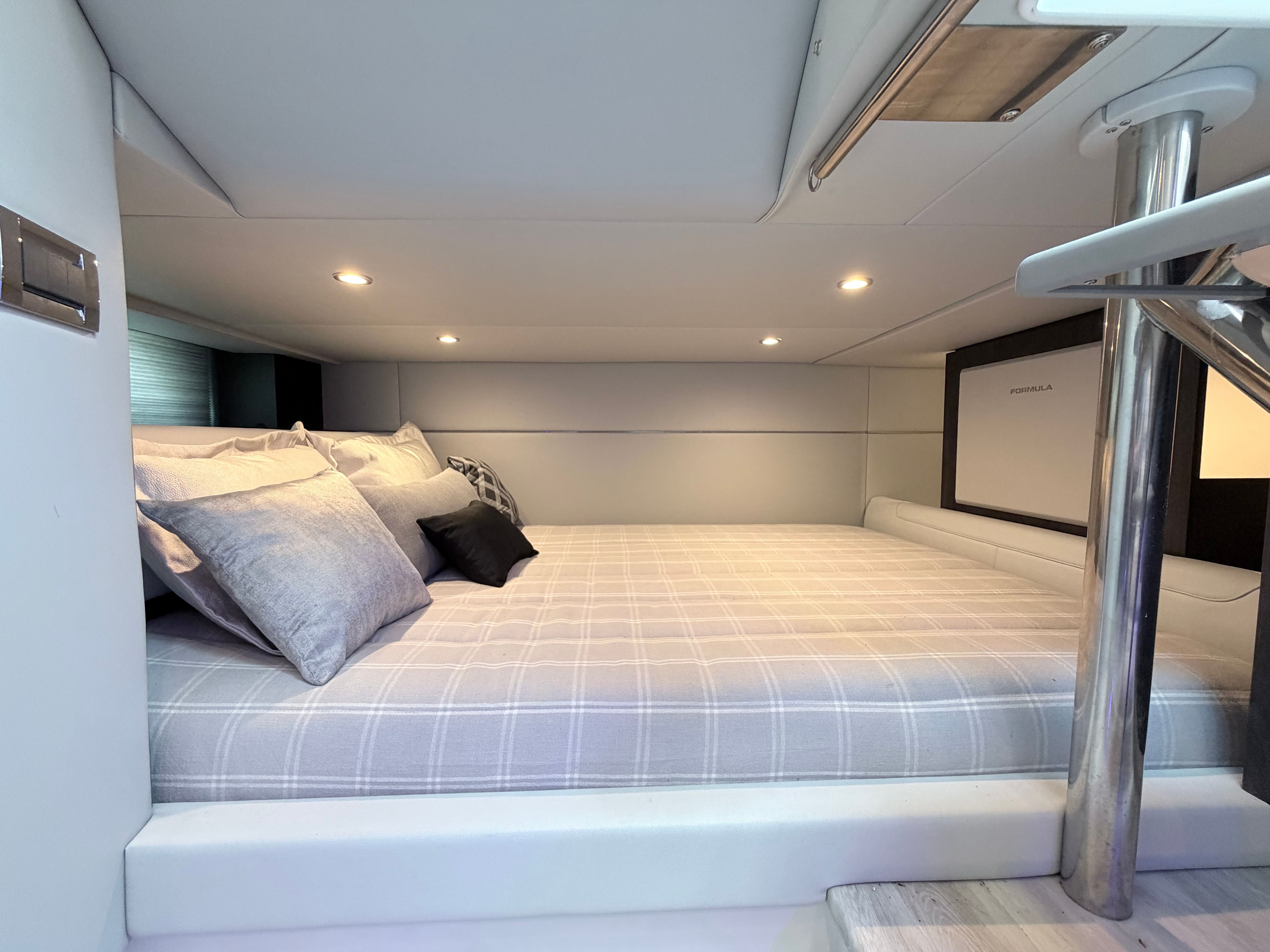 Interior of the 2023 Formula 400 Super Sport Crossover with a cozy bed and modern lighting.