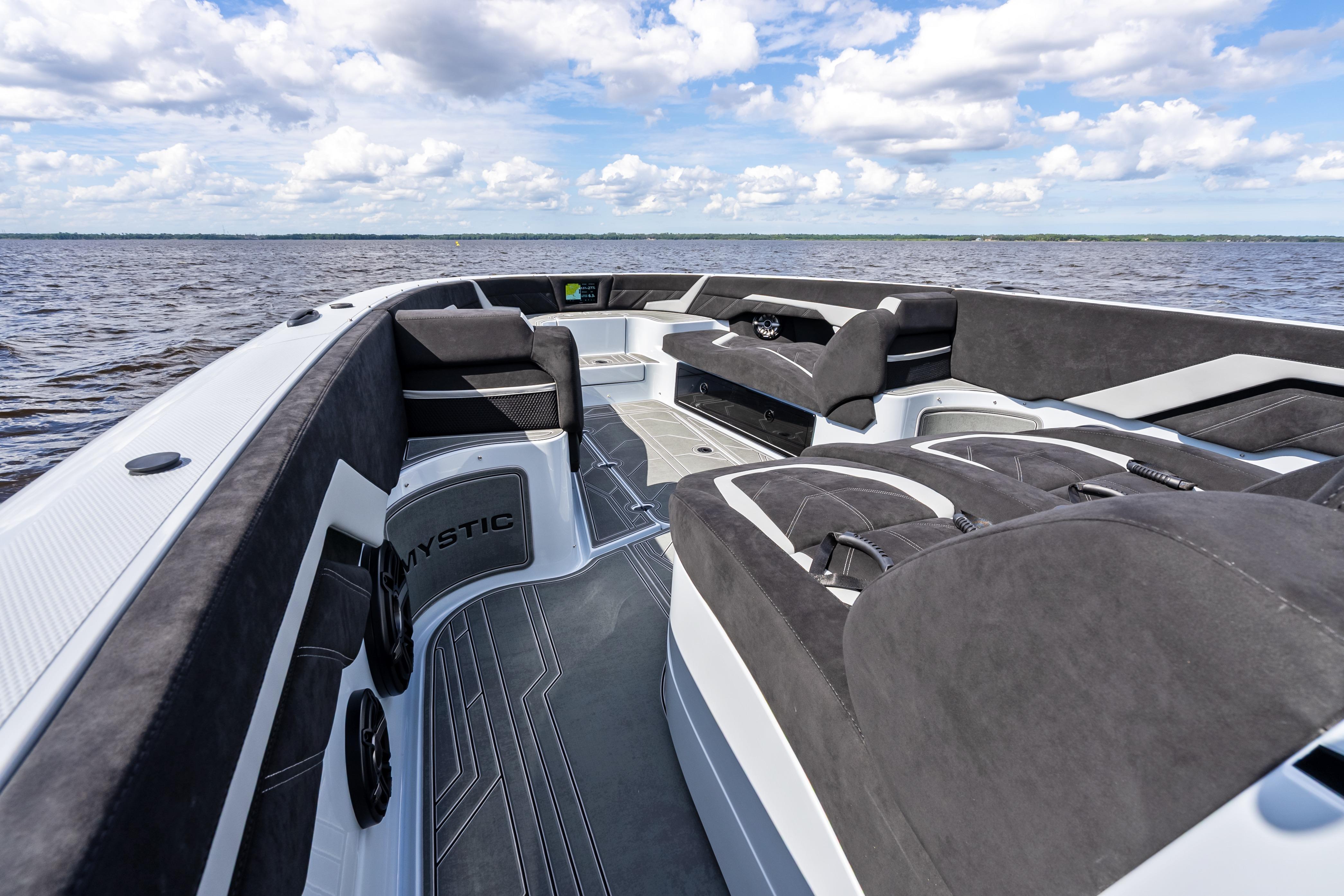 2027 Mystic Powerboats M4200 interior with luxurious seating on open water.