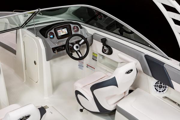 Manufacturer Provided Image: 2022 Chaparral 23 SSi boat interior, featuring modern helm, steering wheel, and comfortable seating.