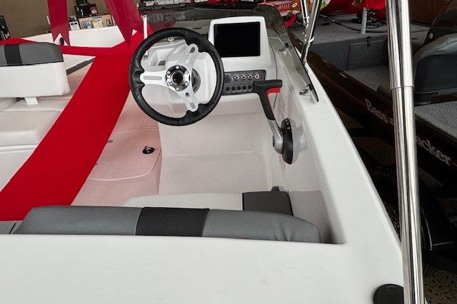 2026 Tahoe T16 boat interior with steering wheel and control panel.