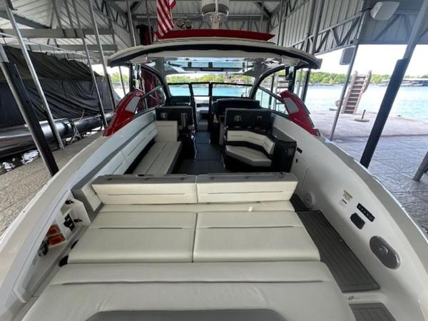 2022 Cobalt A36BR boat interior with white seating, docked under a covered area.