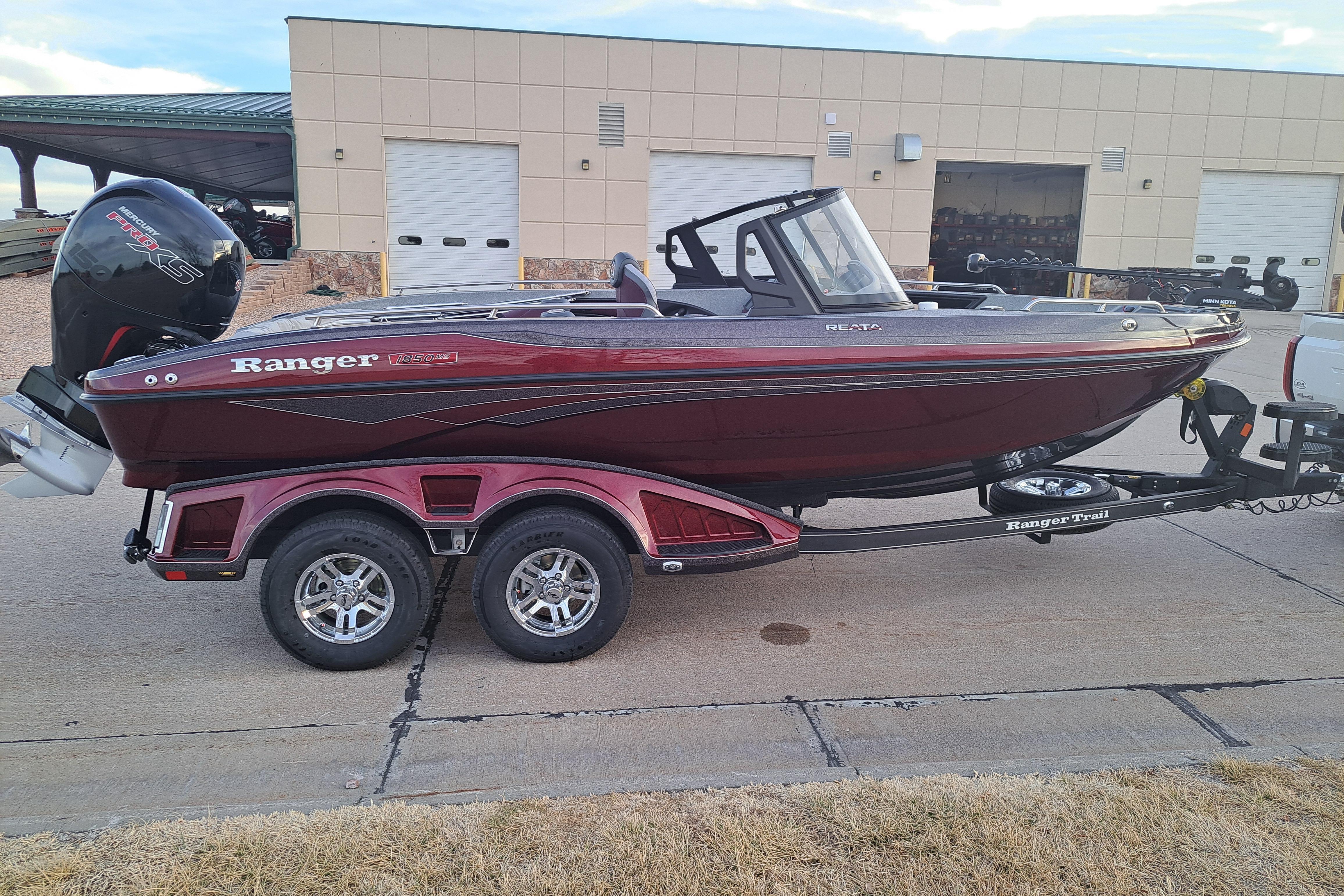 2026 Ranger 1850MS boat on trailer, parked outside a building.