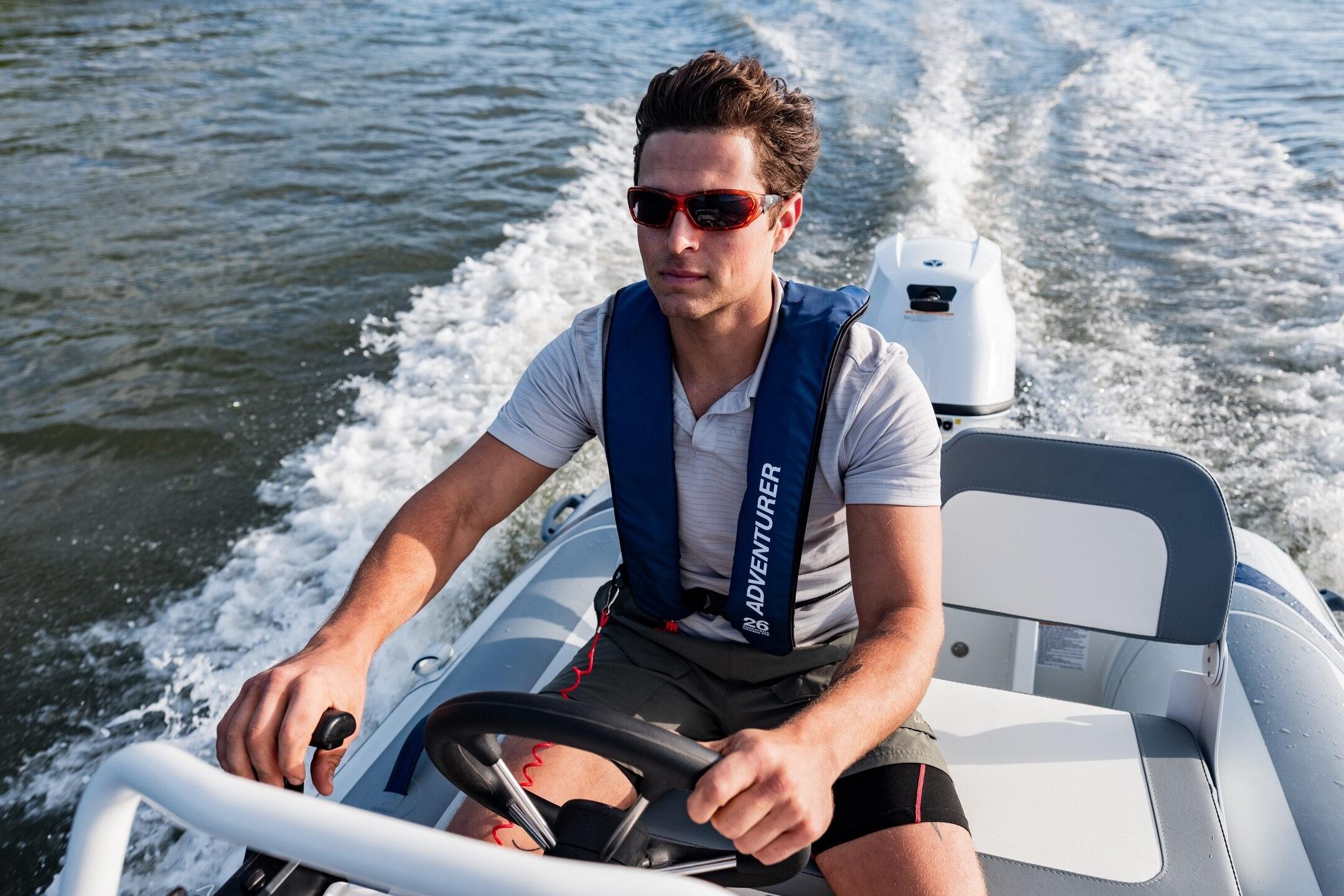 Man driving 2024 Highfield Classic 380 GT on water.