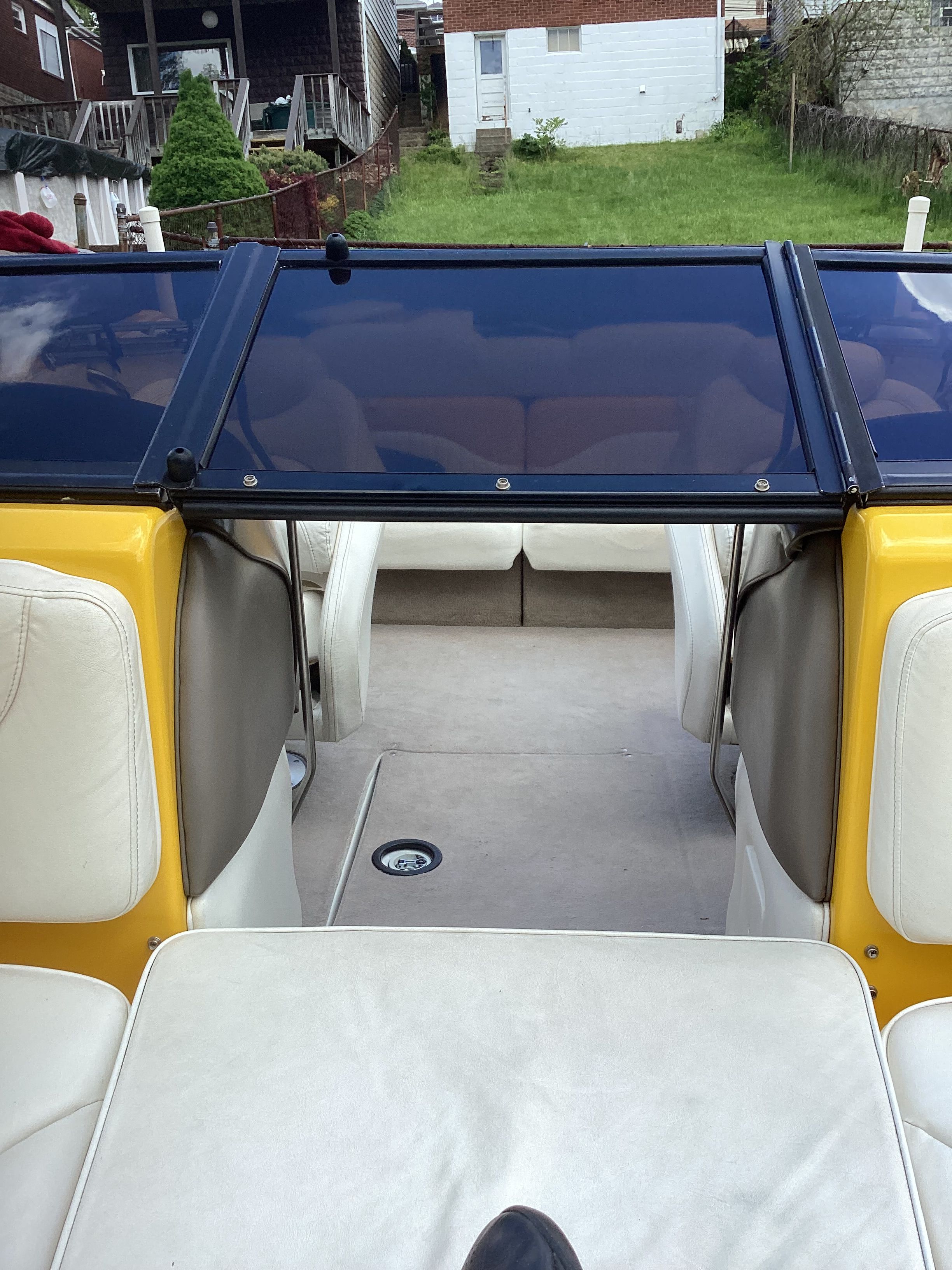 Interior of a 2005 Crownline 202 BR LPX boat with white seats.