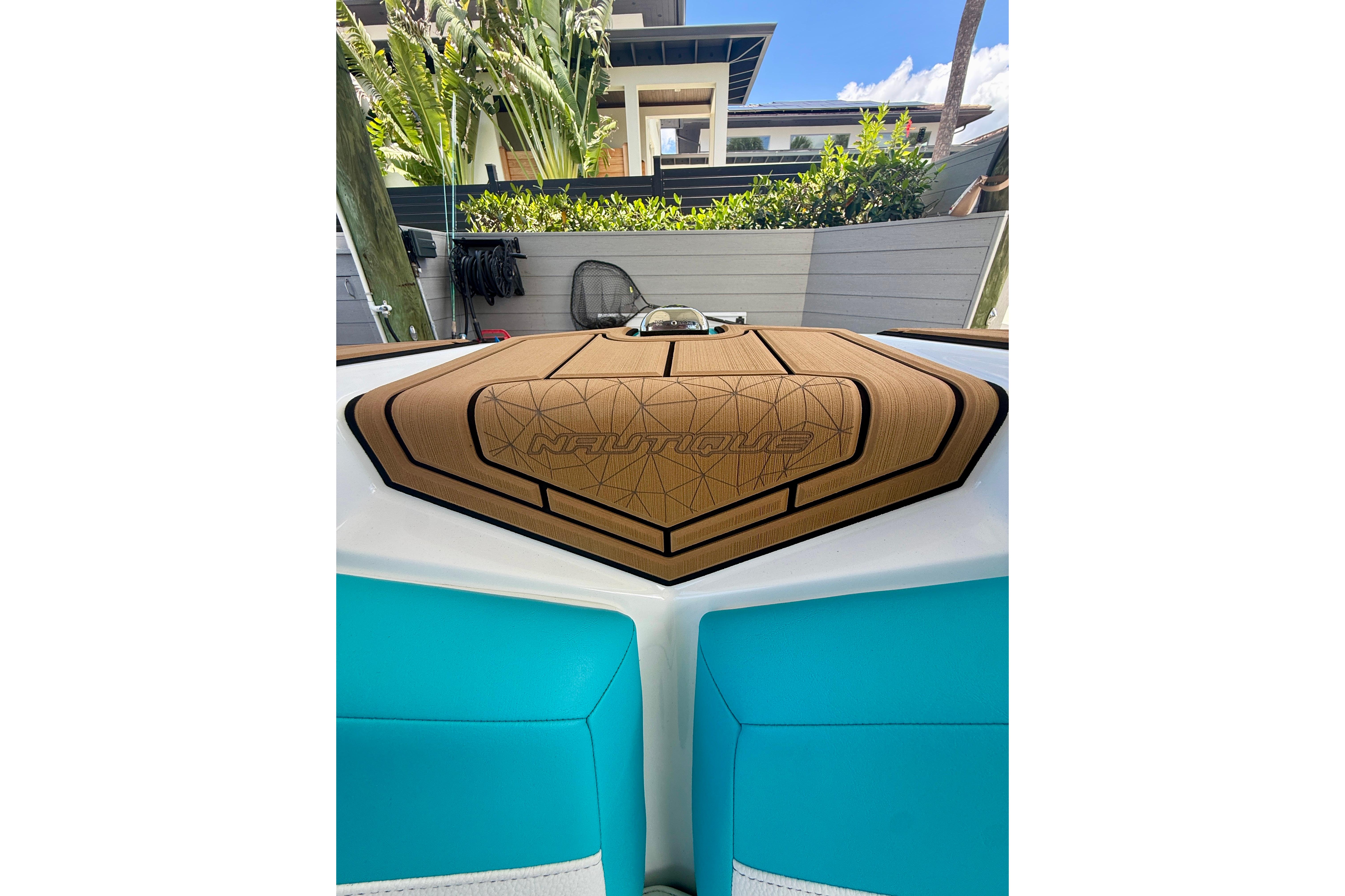 2024 Nautique Super Air Nautique GS20 boat interior with teal and tan upholstery.