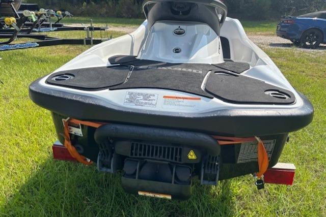 2010 Sea-Doo GTX 155 jet ski on grass, rear view.