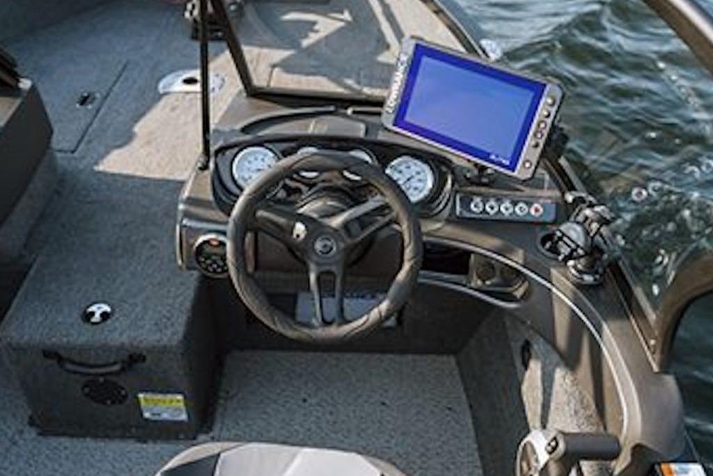 2026 Crestliner 1650 Hawk WT boat dashboard with steering wheel and navigation display.