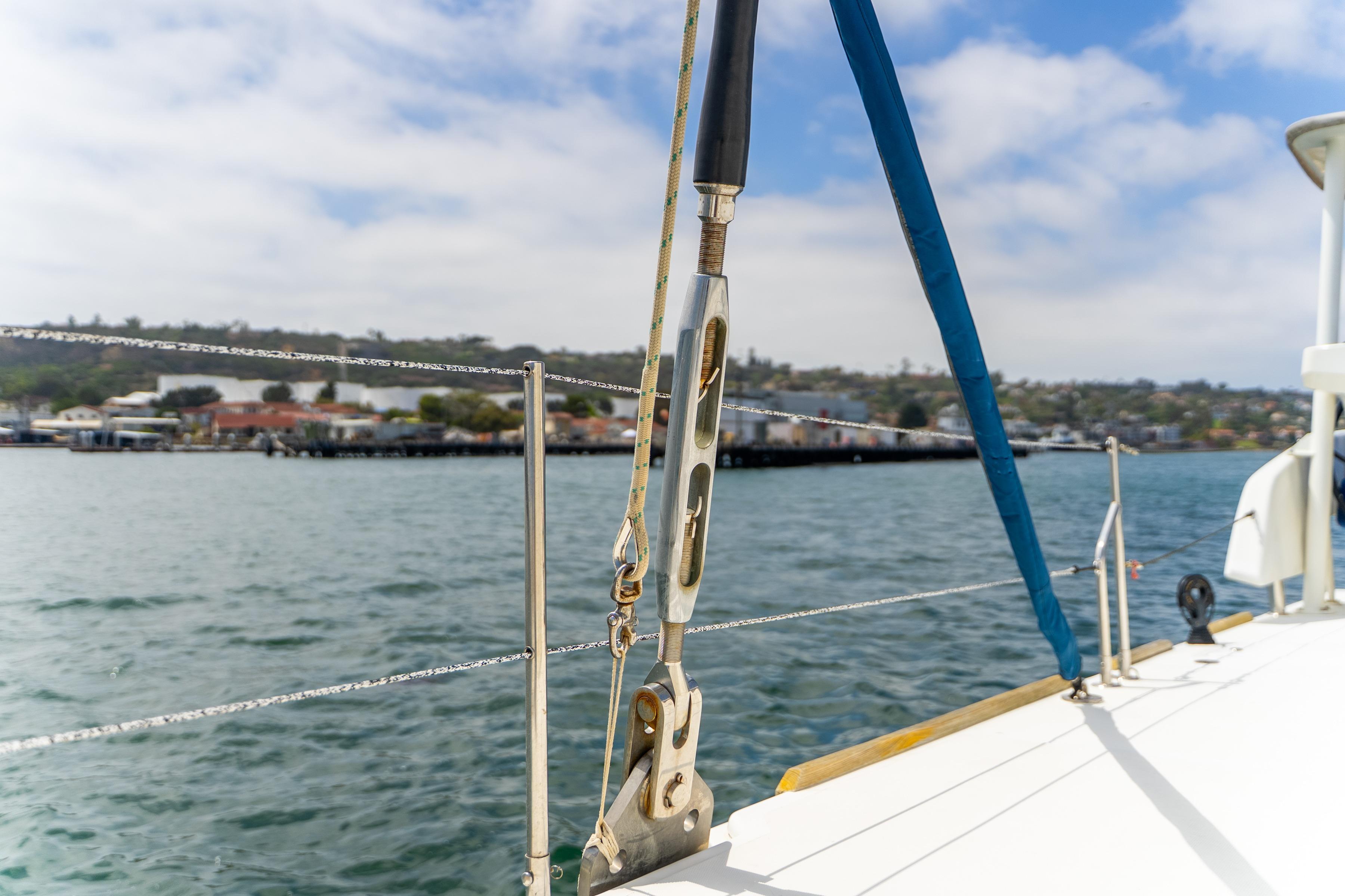 Catana 65 sailboat deck view, 2009 model, overlooking calm waters and distant shoreline.