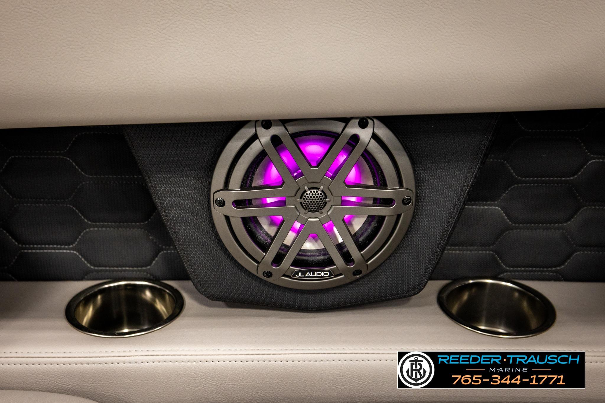 2024 FOURWINNS HD5 Surf boat speaker with purple LED lighting and cup holders.