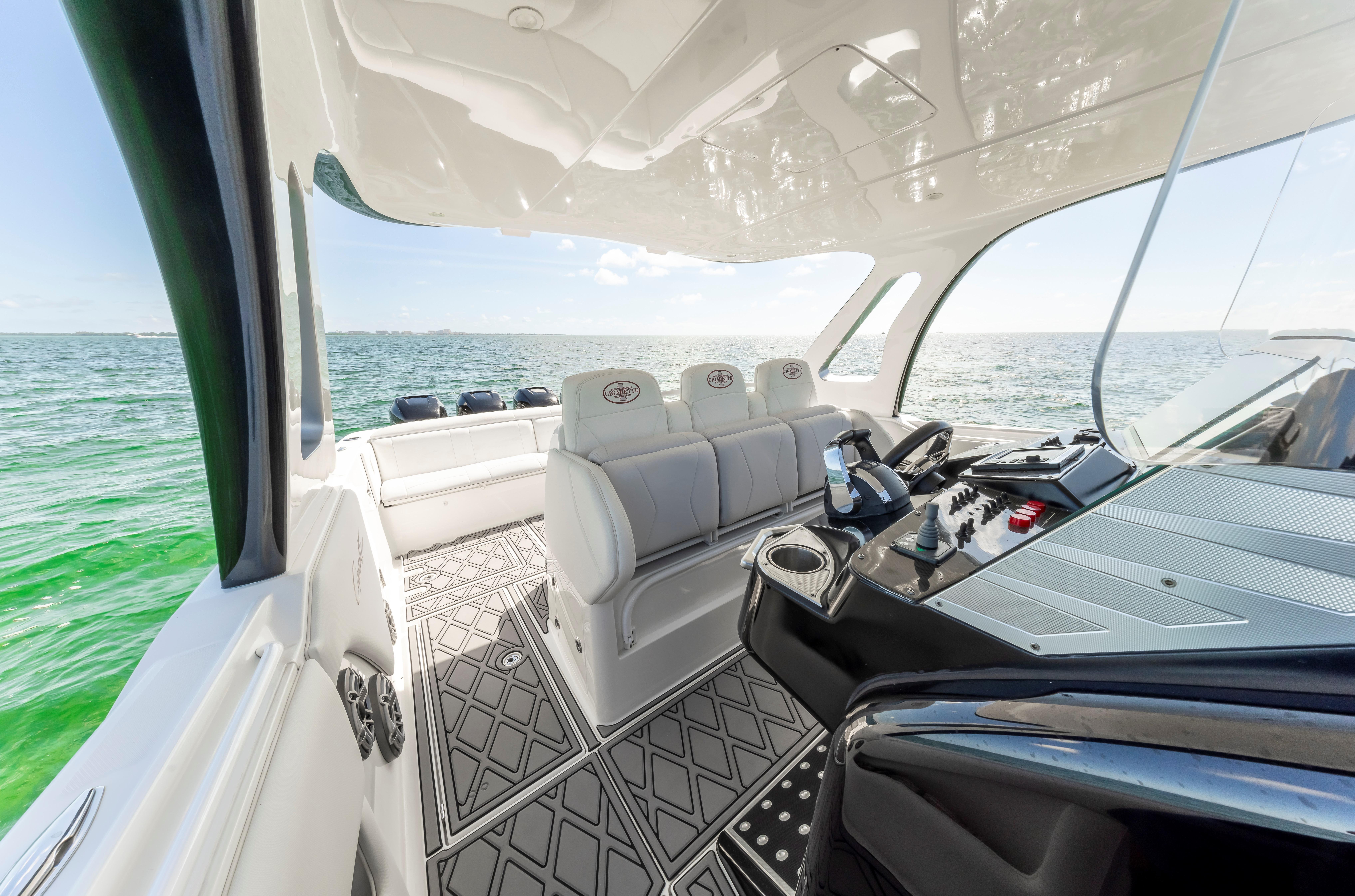 Interior of 2016 Cigarette 41 GTR boat with luxurious seating and modern dashboard.