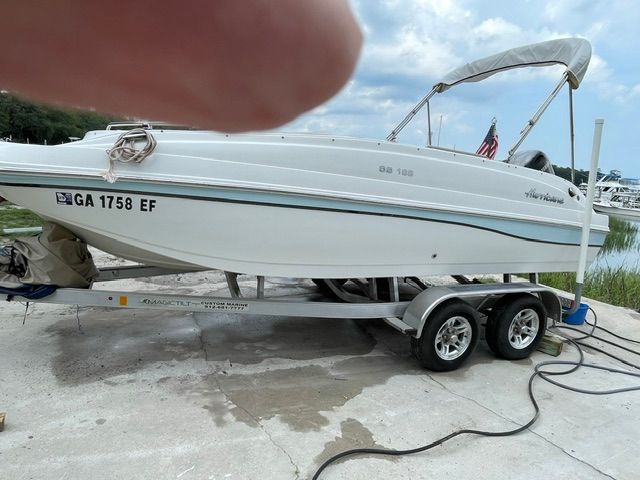 A 2018 Hurricane SS188 boat is on a trailer on land.
