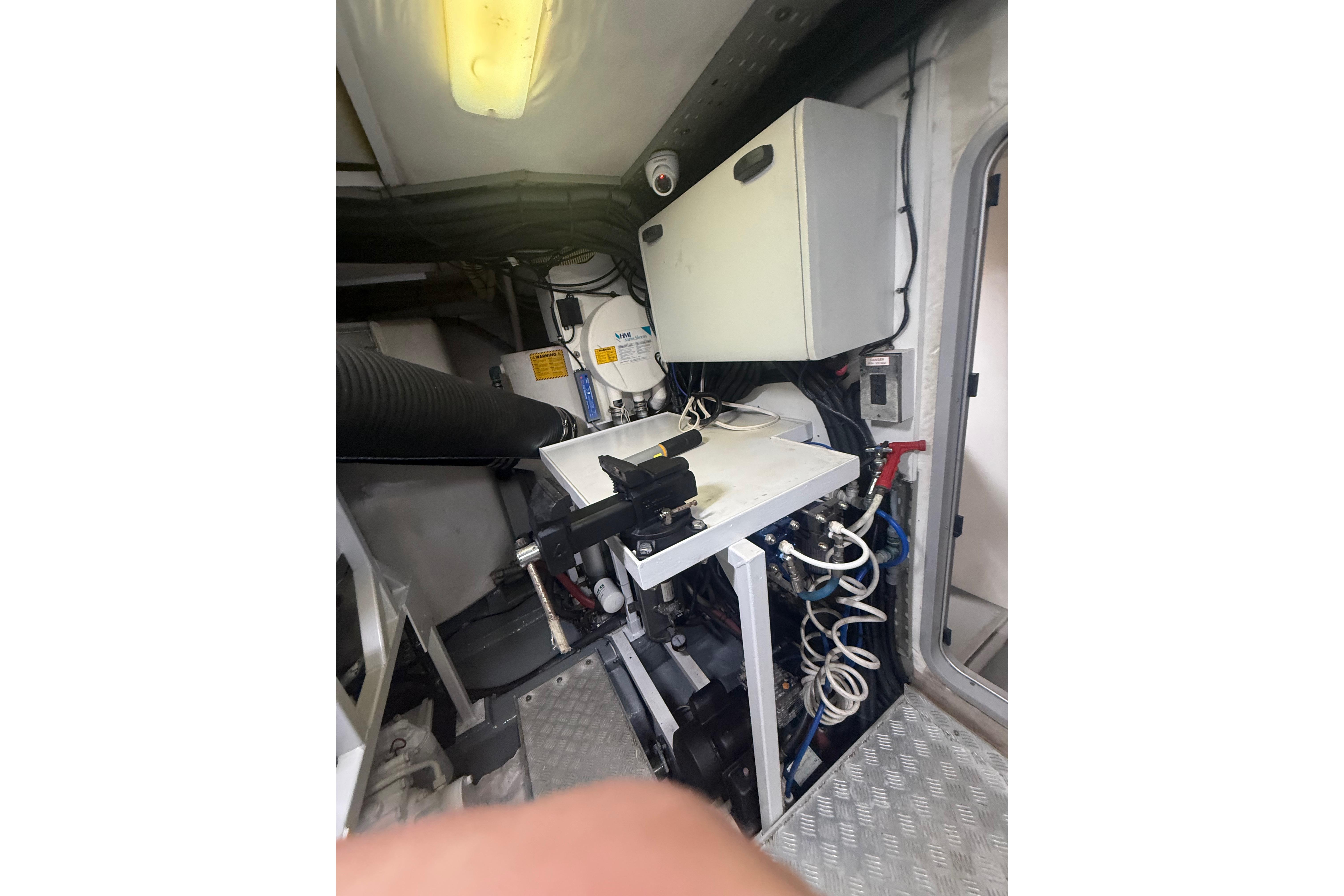 Engine room of 2008 Viking Princess 75 yacht, featuring mechanical equipment and storage.