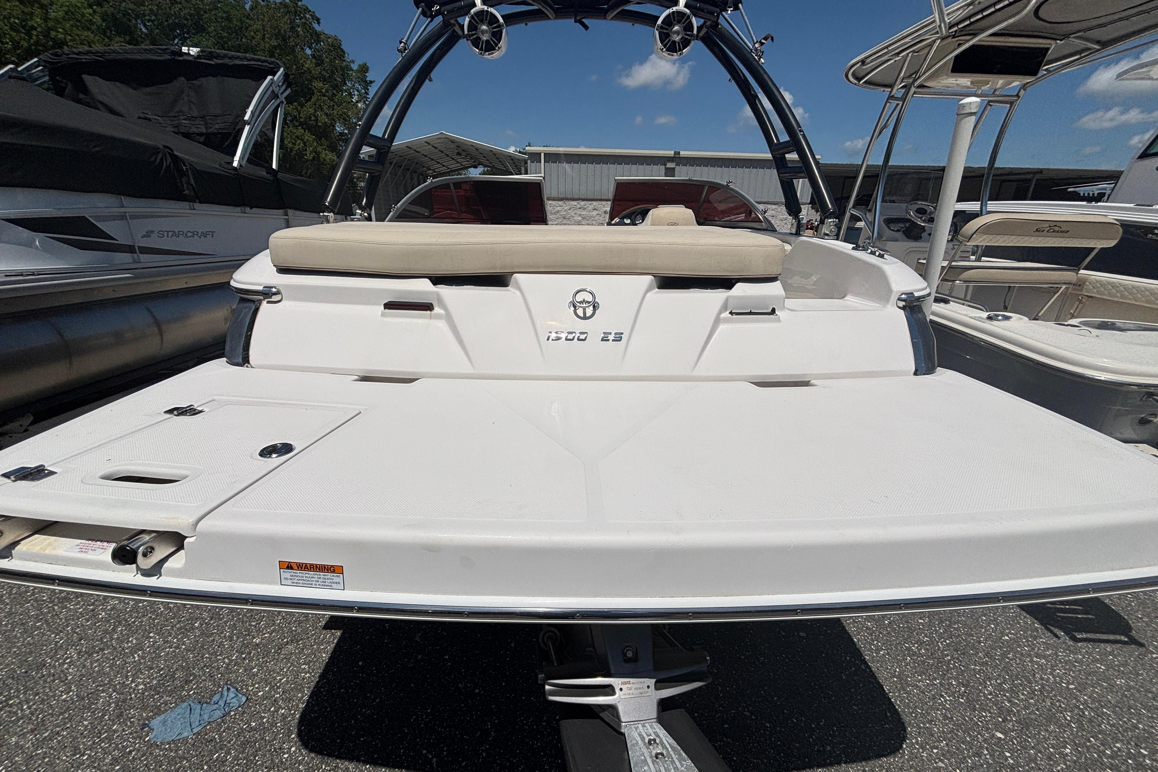 2018 Regal 1900 ES Bowrider boat, rear view, parked on trailer.