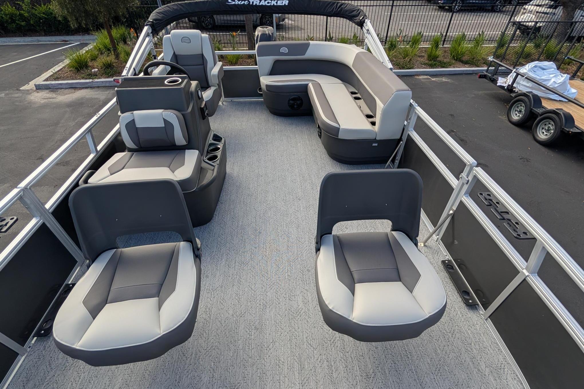 2026 Sun Tracker Bass Buggy 16 XL Select pontoon boat with spacious seating and modern design.