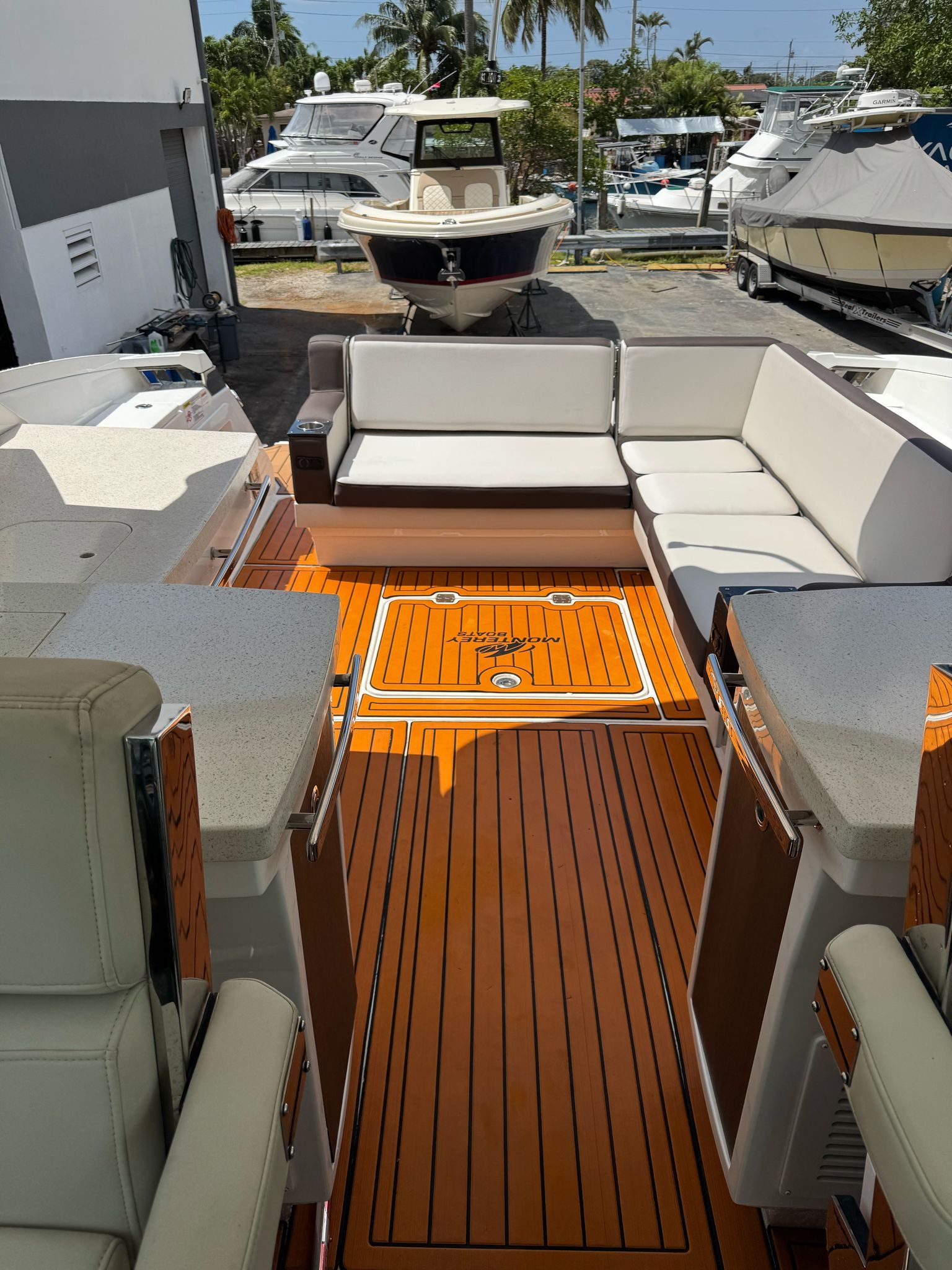 Interior of a 2015 Monterey 360 Sport Coupe yacht with wooden flooring.
