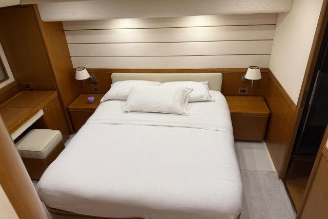 Luxurious bedroom interior of 2008 Apreamare Maestro 65 yacht with modern furnishings.