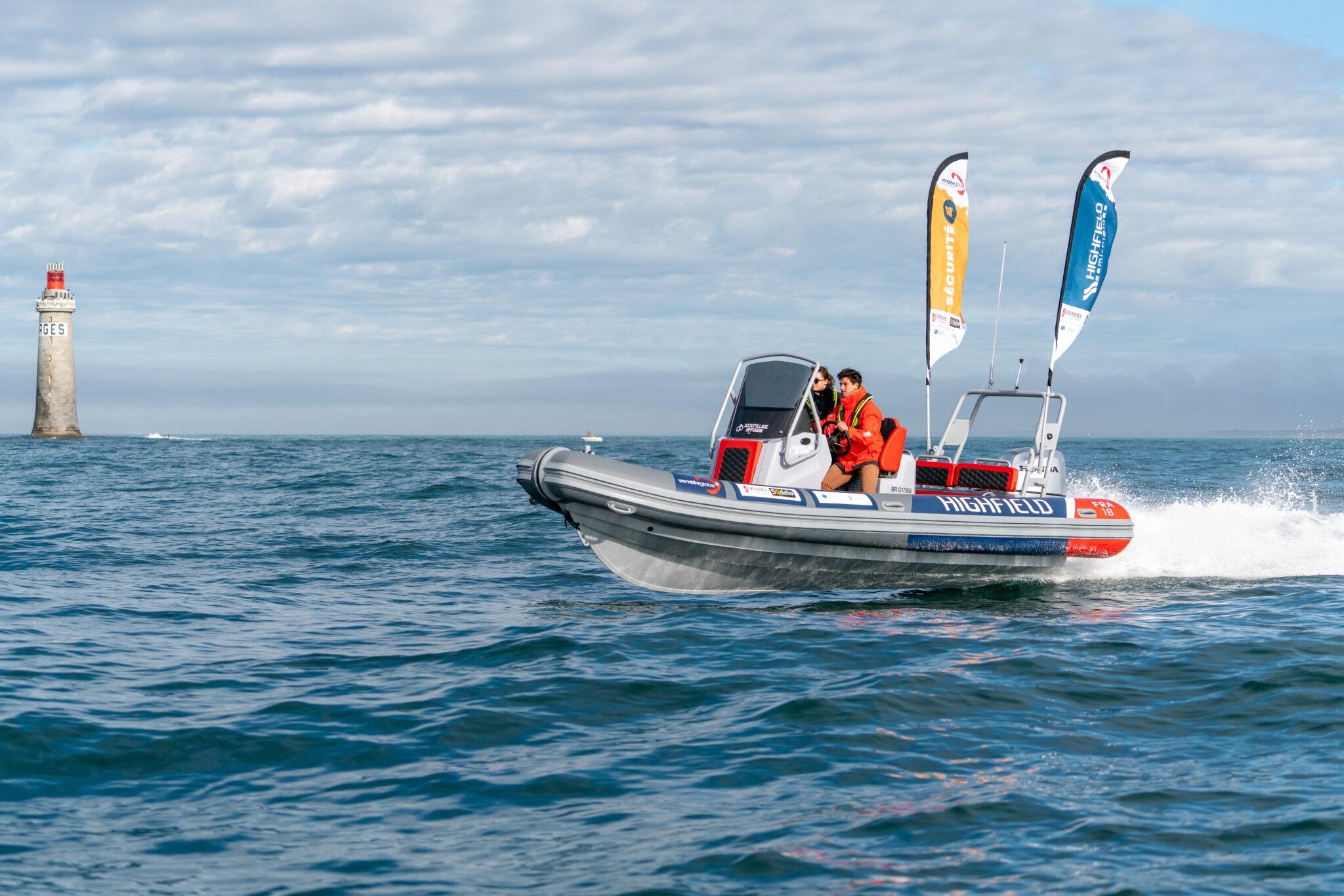 2026 Highfield Patrol 660 boat cruising near a lighthouse on open water.