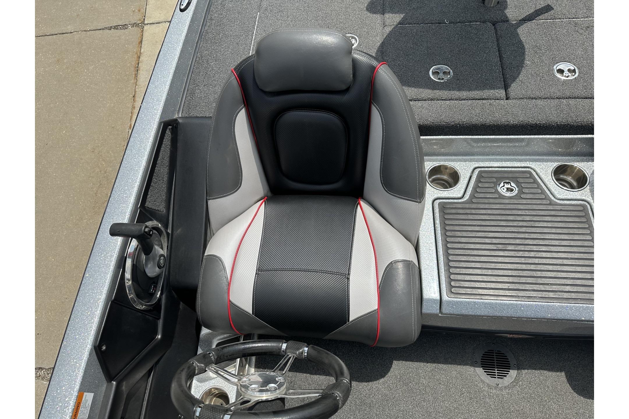 2018 Ranger Z518 boat cockpit with steering wheel and cushioned seat.