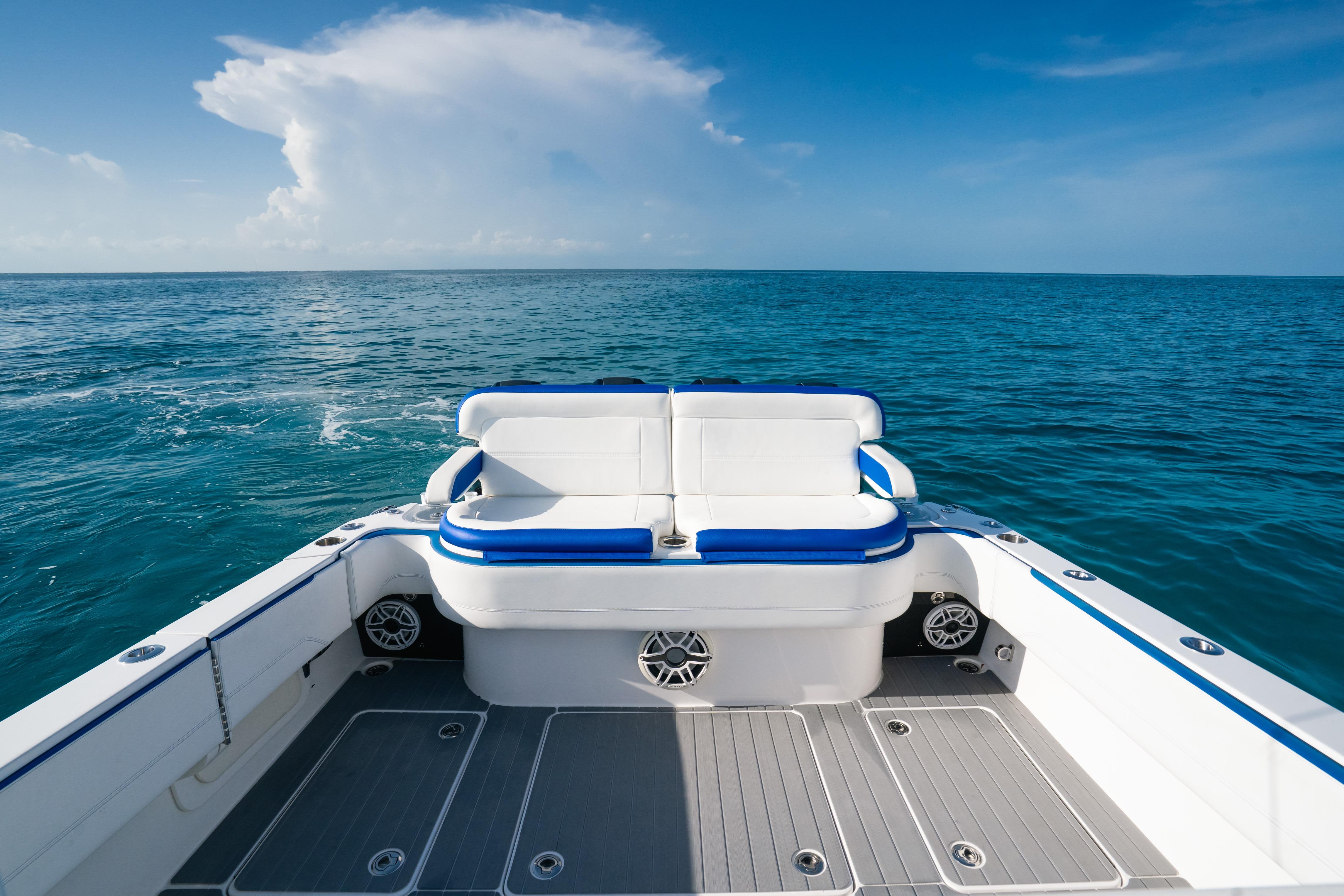 2022 Nor-Tech 392 Super Fish boat on open ocean, featuring spacious seating.