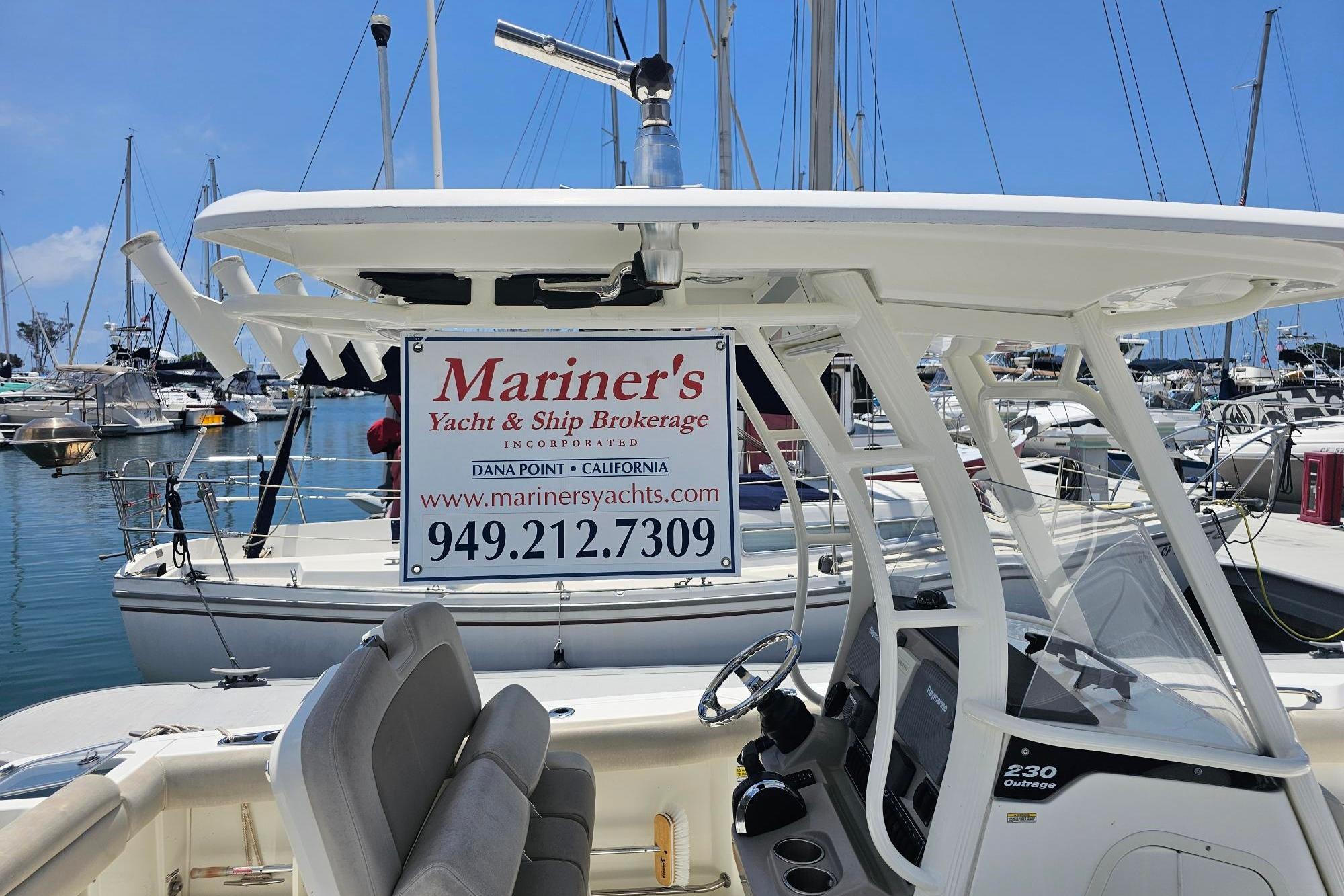 2017 Boston Whaler 230 Outrage at marina with brokerage sign, Dana Point, California.