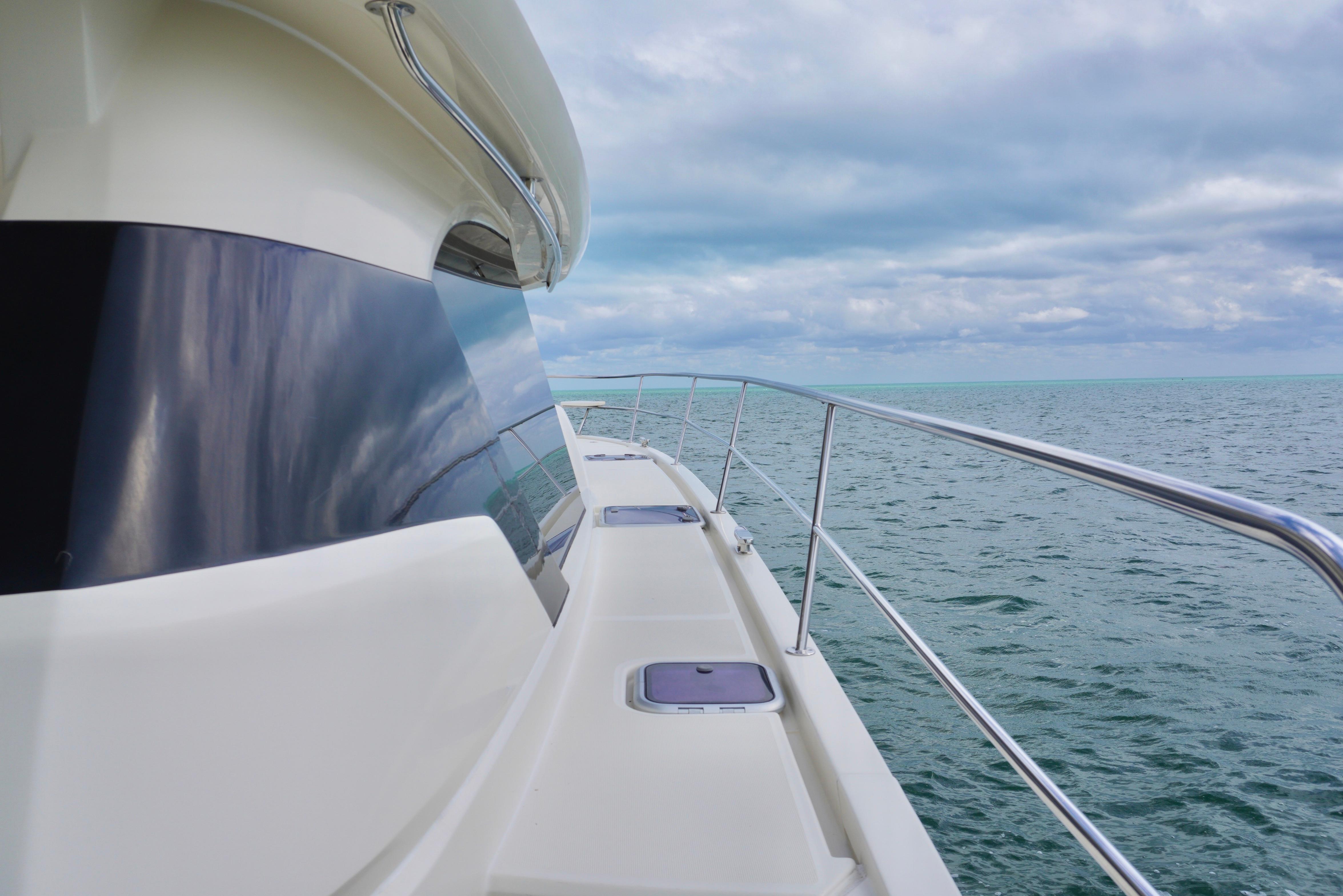 2017 Aquila 44 Yacht cruising on open sea under cloudy skies.
