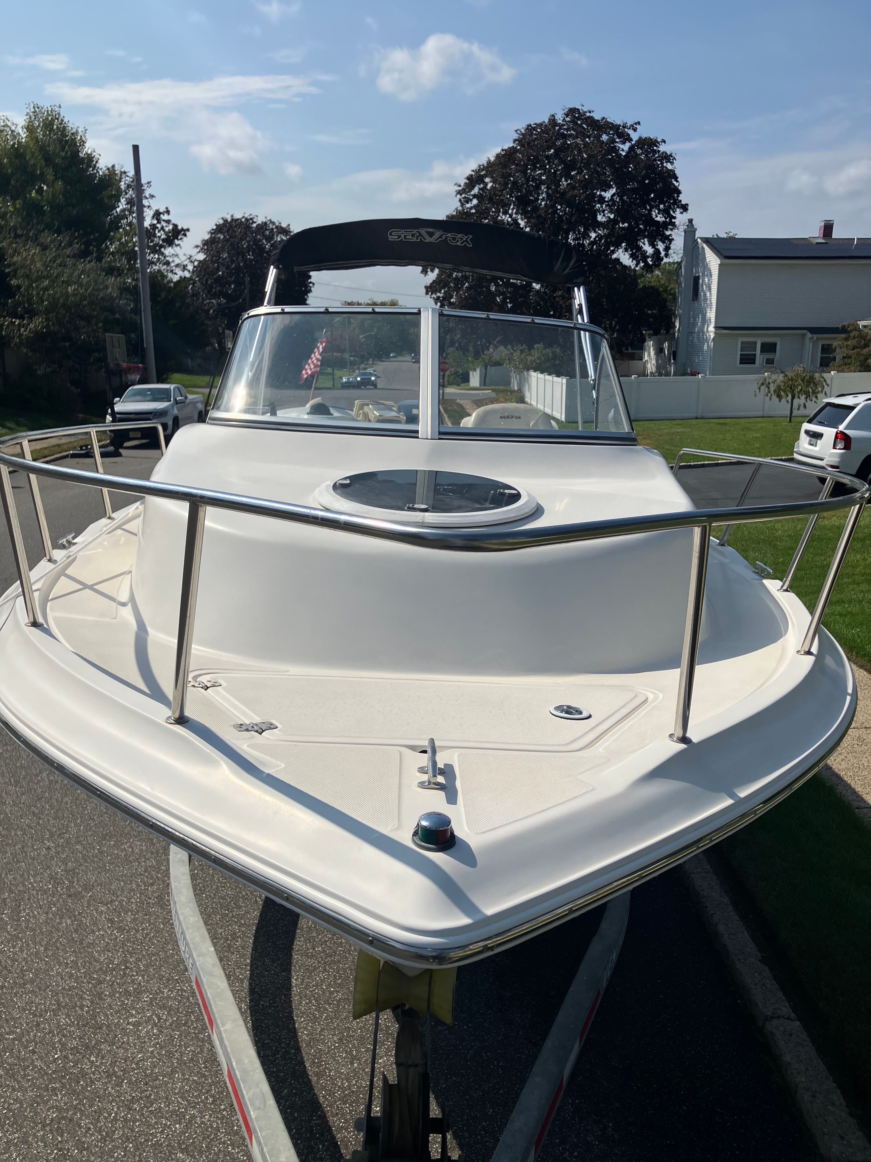 2010 Custom 216wa Pro boat on trailer, front view.