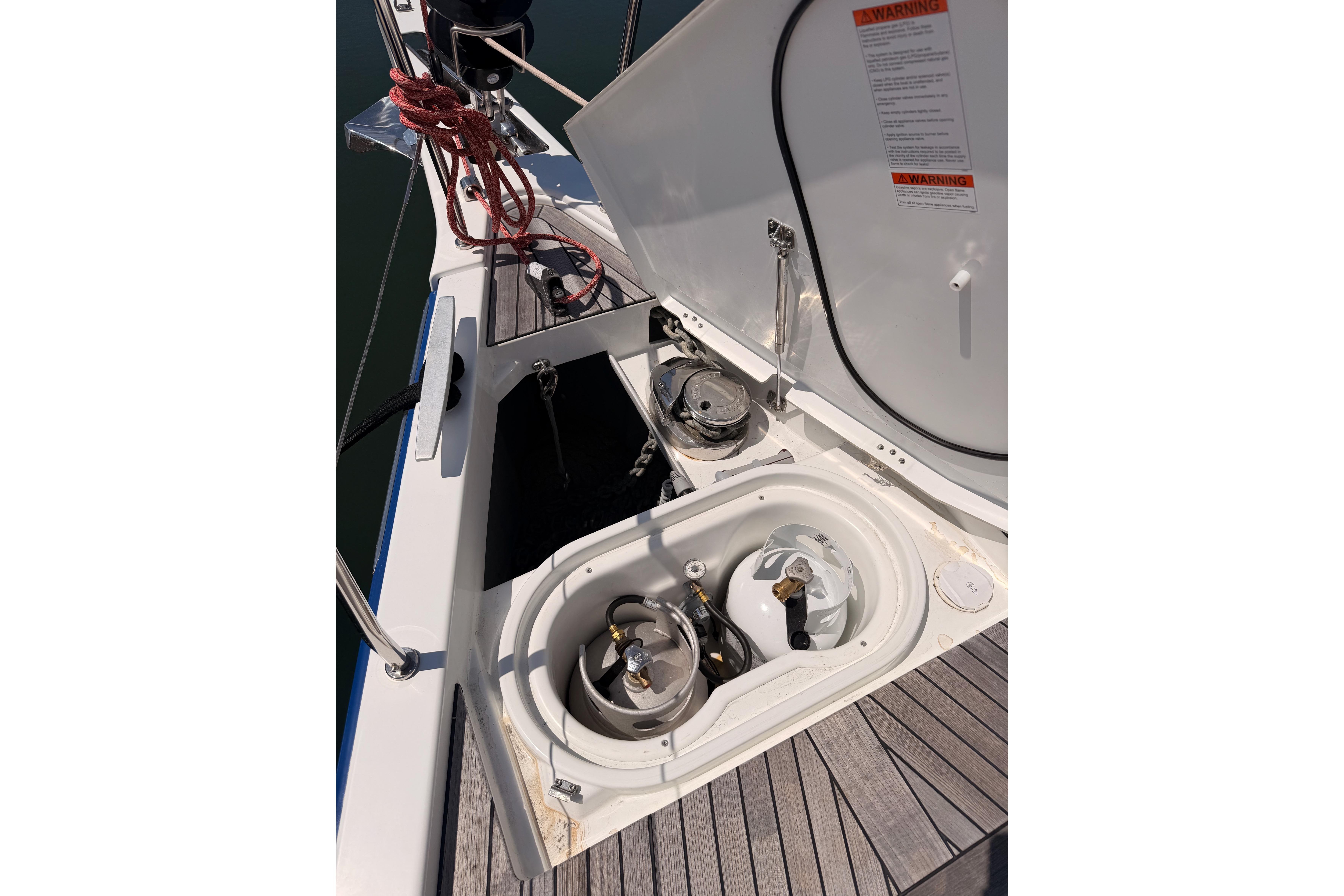 Beneteau Oceanis Yacht 54 (2022) deck with open storage compartments and equipment.