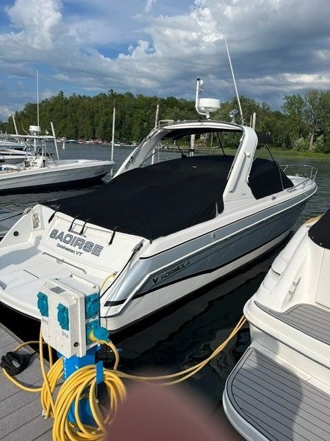 2006 Formula 330 Sun Sport boat docked at marina.