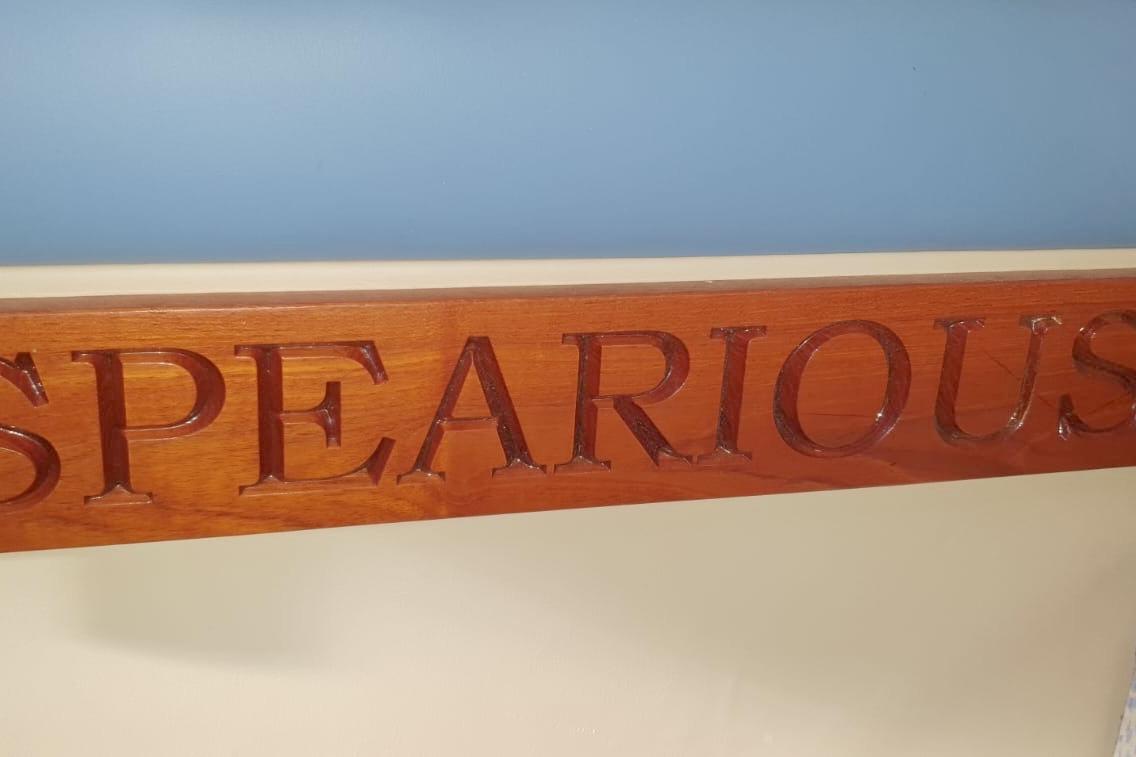 Wooden nameplate with "SPEARIOUS" engraved, related to Fairey Spearfish MKIII, 1989.