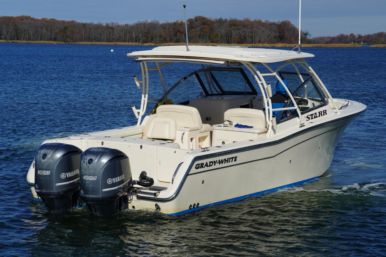 2015 Grady-White Freedom 307 boat on water with twin Yamaha engines.