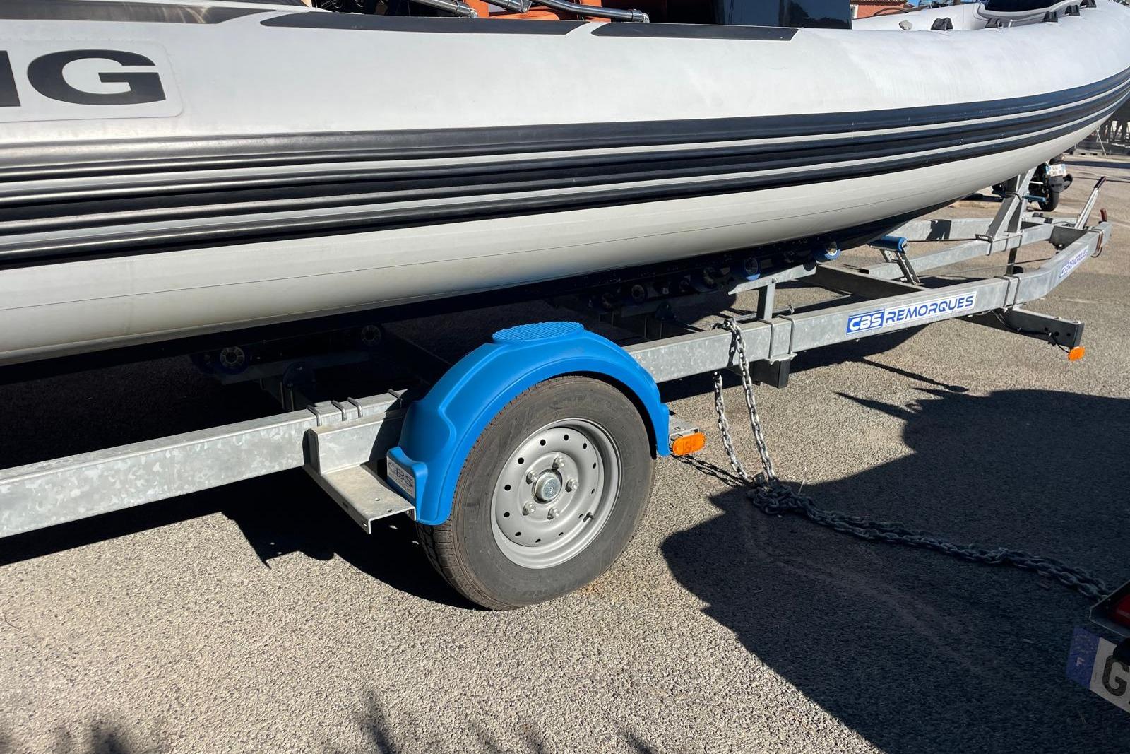 2022 Brig Eagle 6.7 boat on CBS Remorques trailer, parked on pavement.