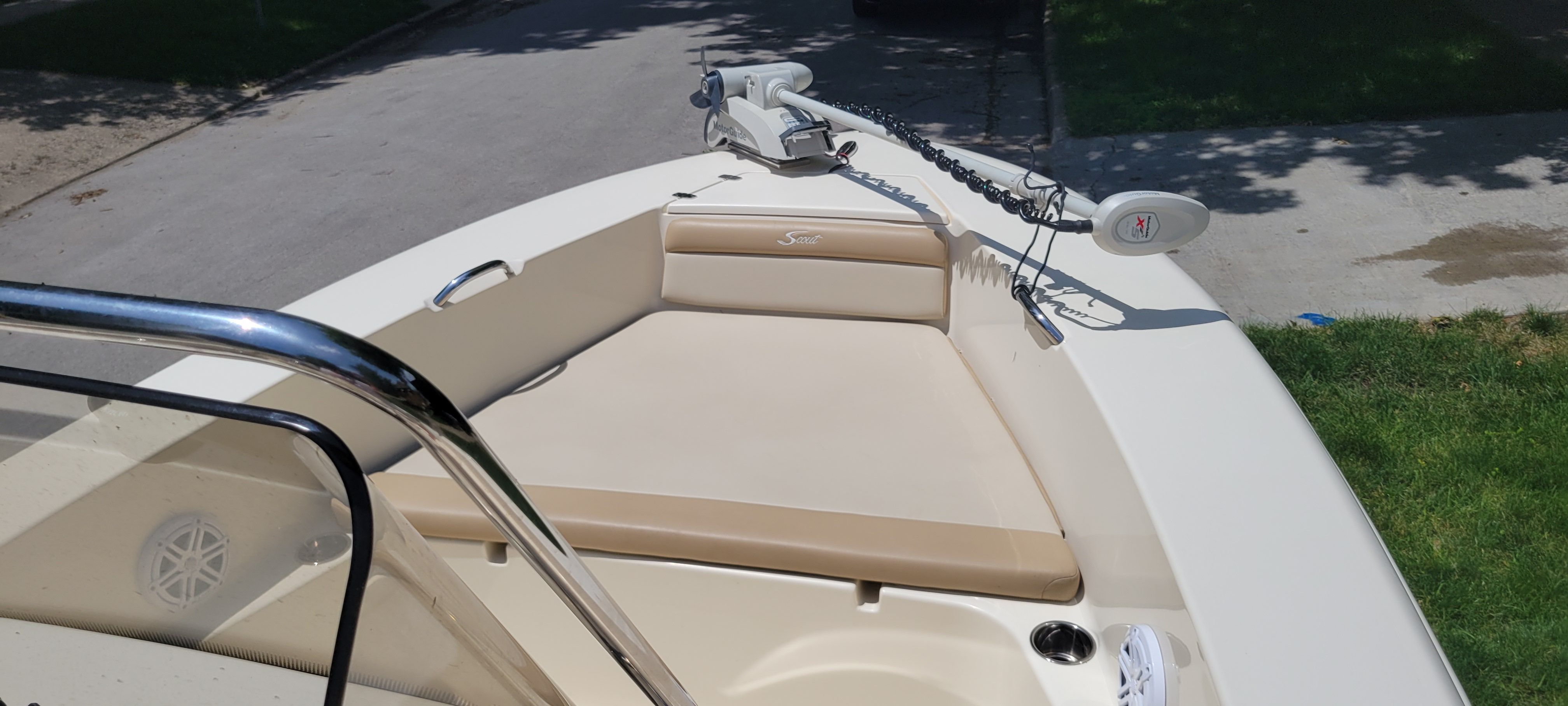 2021 Scout 195 Sportfish with beige upholstery and anchor on the deck.
