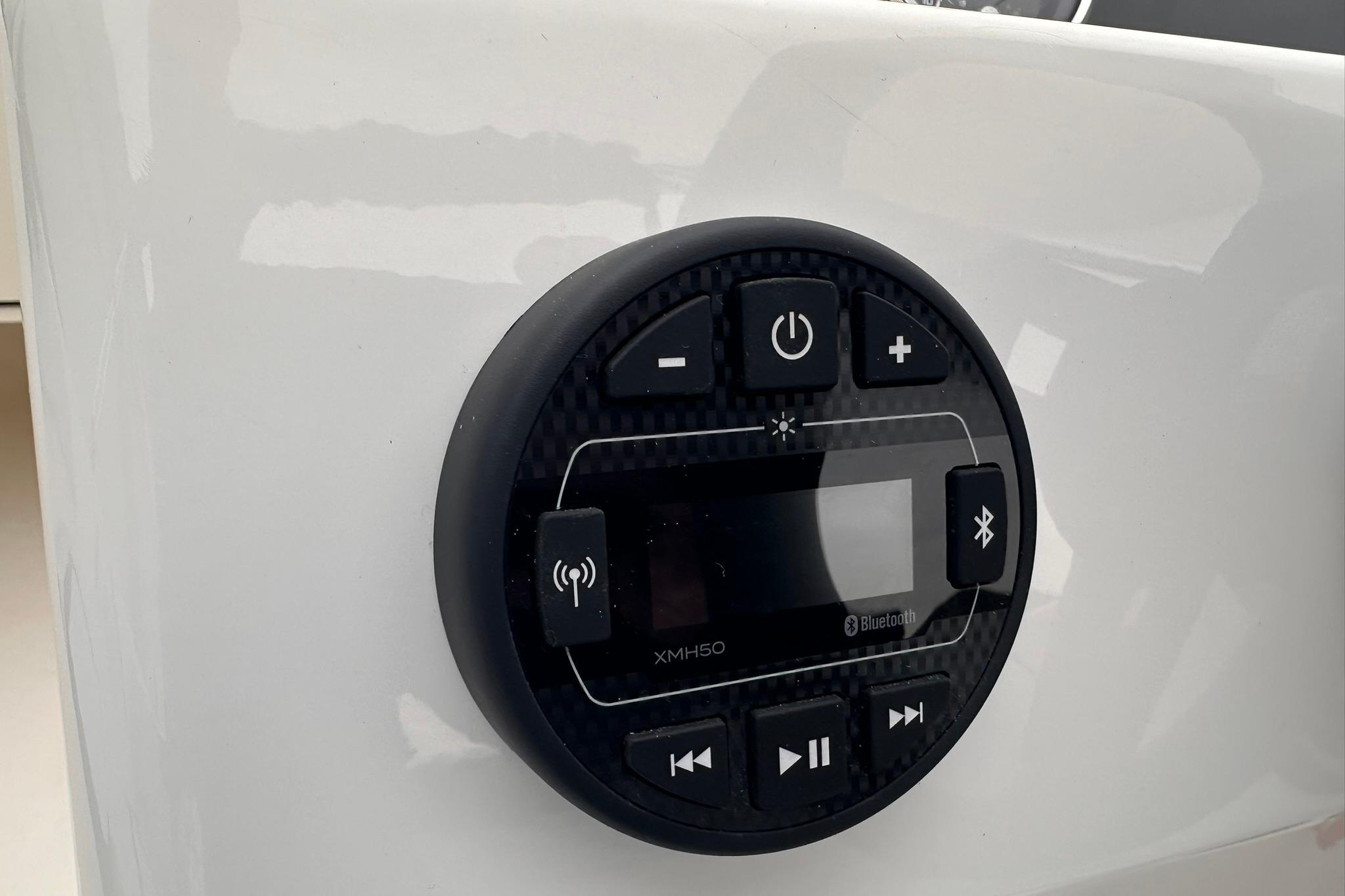 Control panel of 2026 Bayliner M17 boat with Bluetooth and audio features.