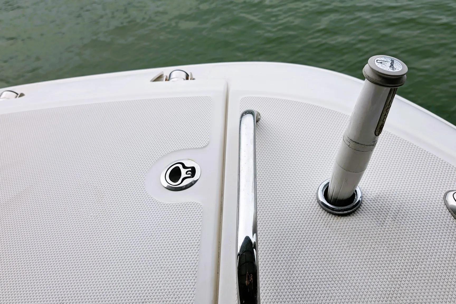 2017 Boston Whaler 320 Vantage boat deck detail with chrome fittings and textured surface.