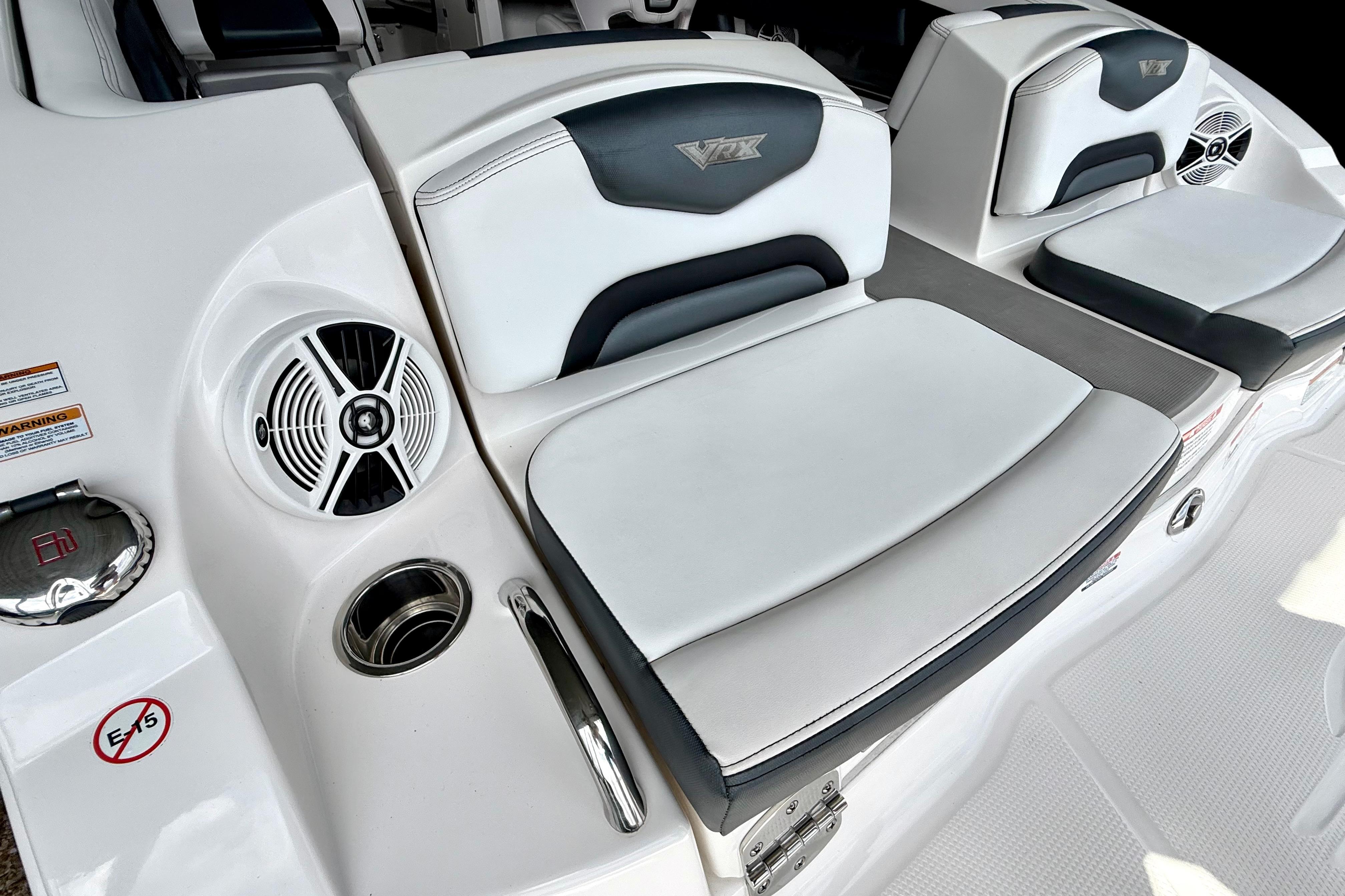 2019 Chaparral Vortex 223 VRX boat interior with cushioned seating and speaker system.