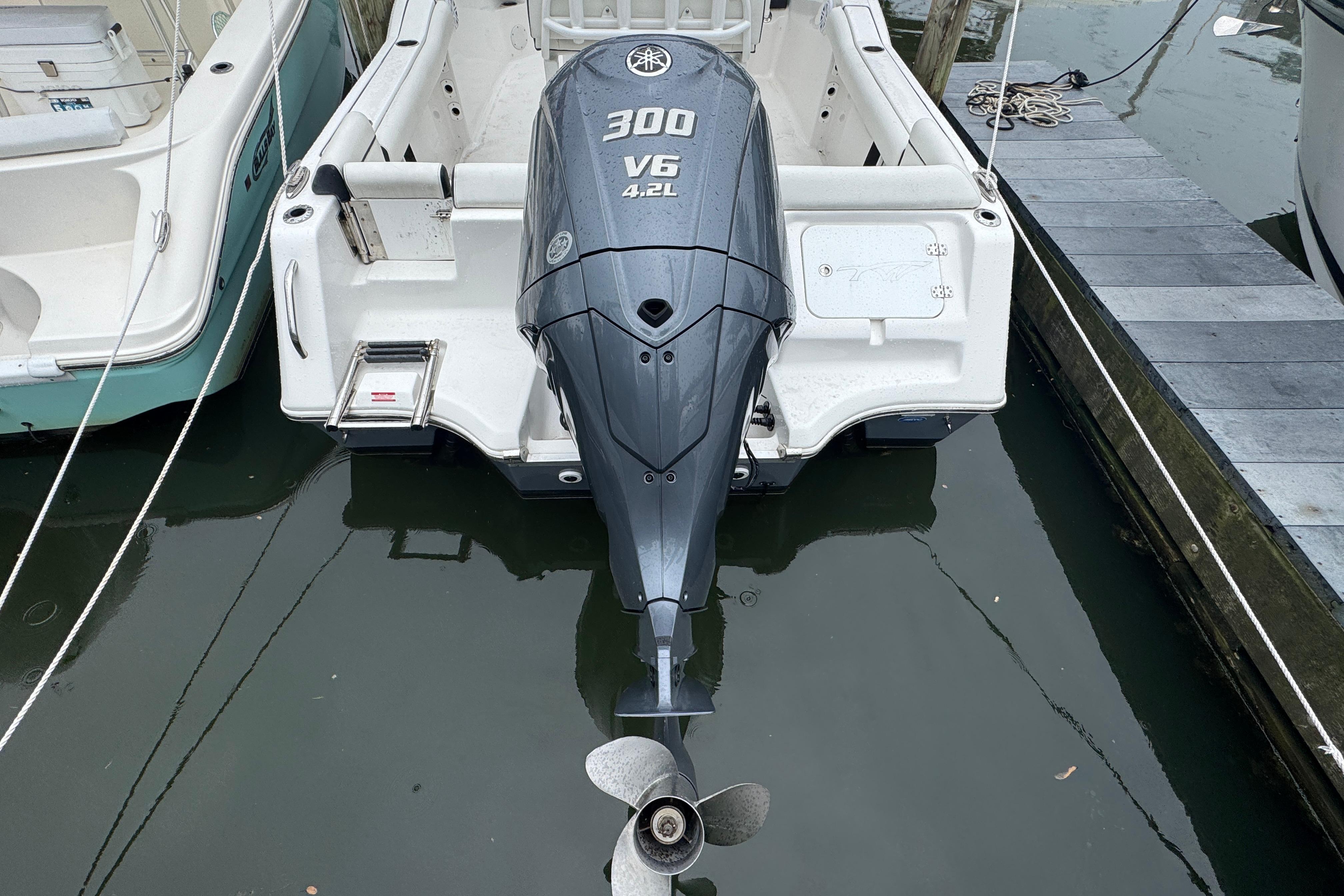 2022 Tidewater 232 SS boat with Yamaha 300 V6 outboard motor at dock.