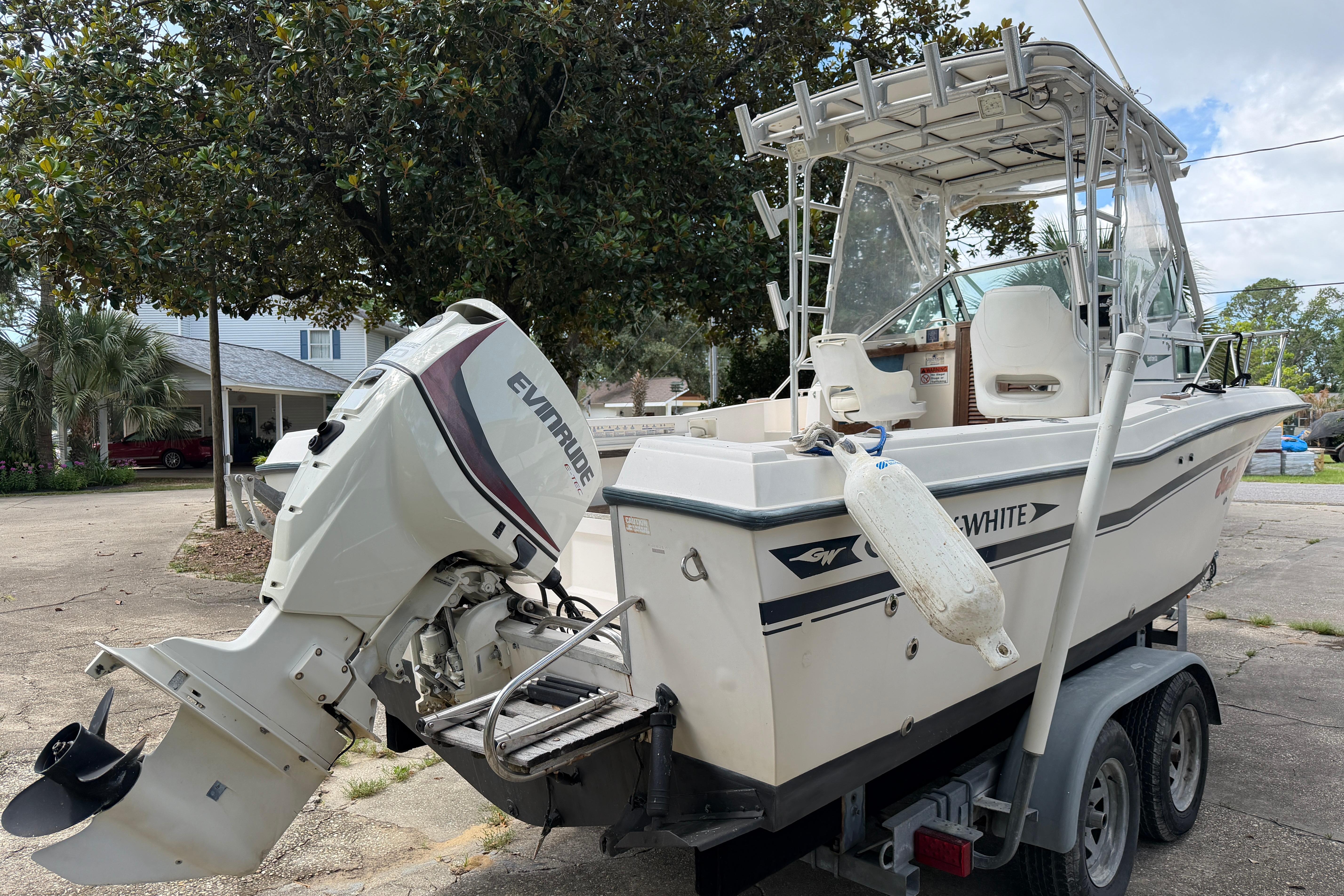 1987 Grady-White Seafarer 226 boat with Evinrude outboard motor on trailer.