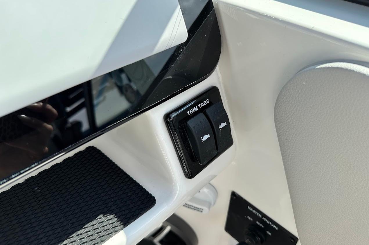 2026 Sea Ray SDX 230 Surf trim tabs control panel close-up.