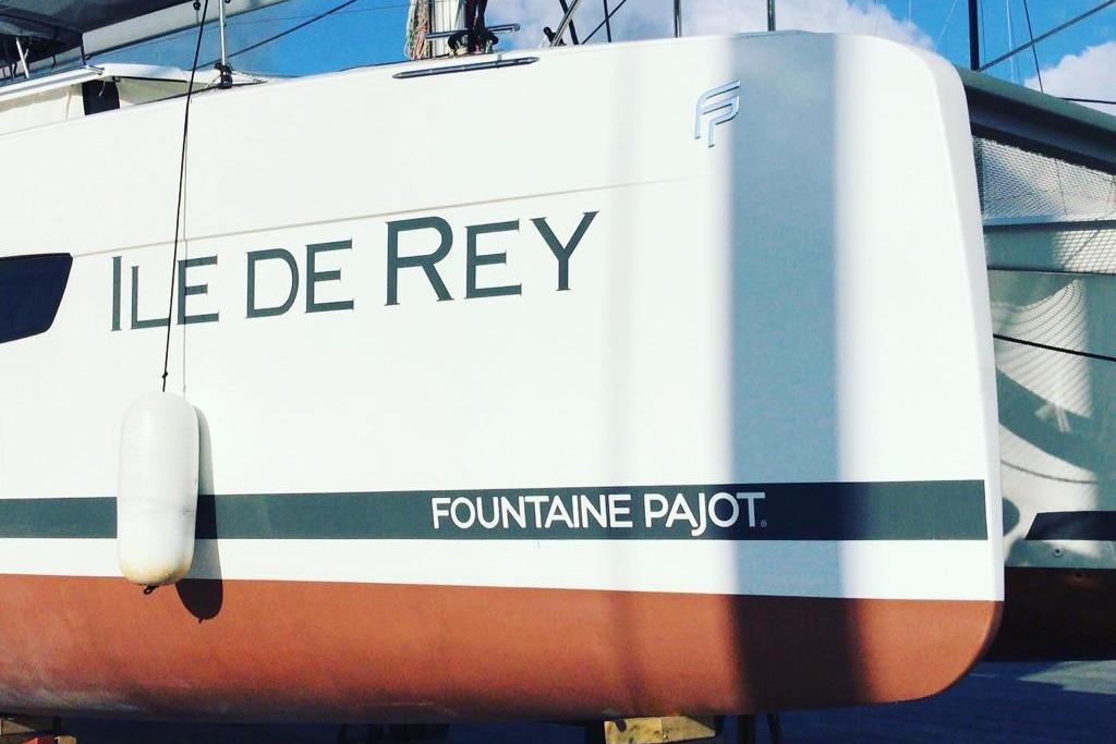 2020 Fountaine Pajot Saona 47 catamaran, "Ile de Rey," docked with visible branding.