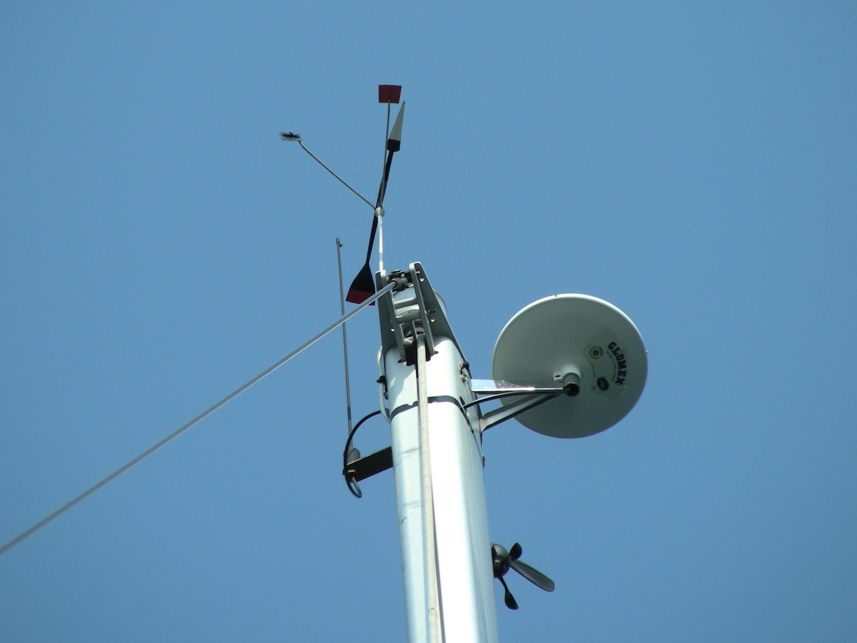 Sailboat mast with radar and wind instruments against clear blue sky, Elan Impression 434, 2008.
